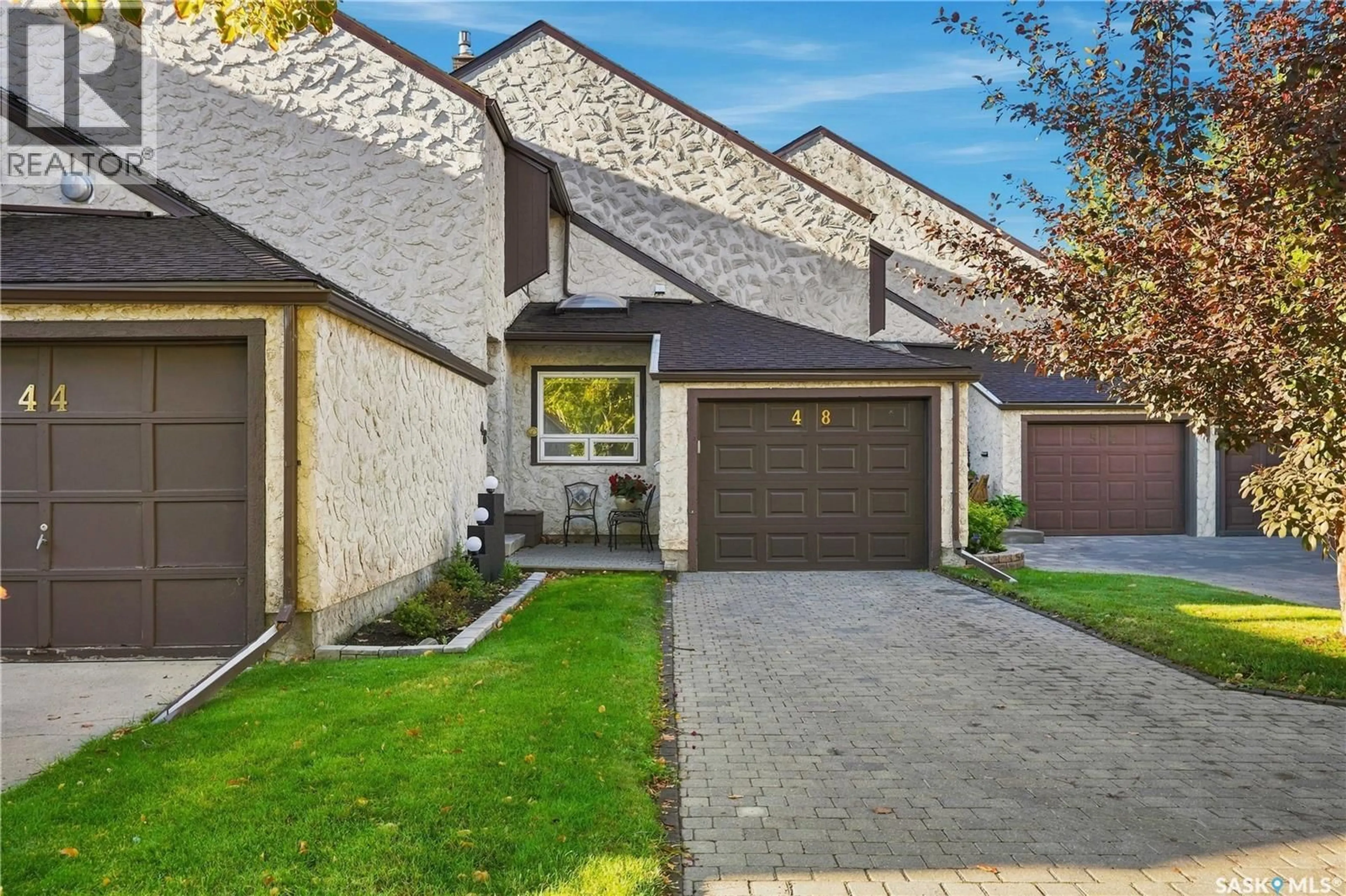 Home with brick exterior material, street for 48 CANNINGTON MEWS, Regina Saskatchewan S4S5Z7