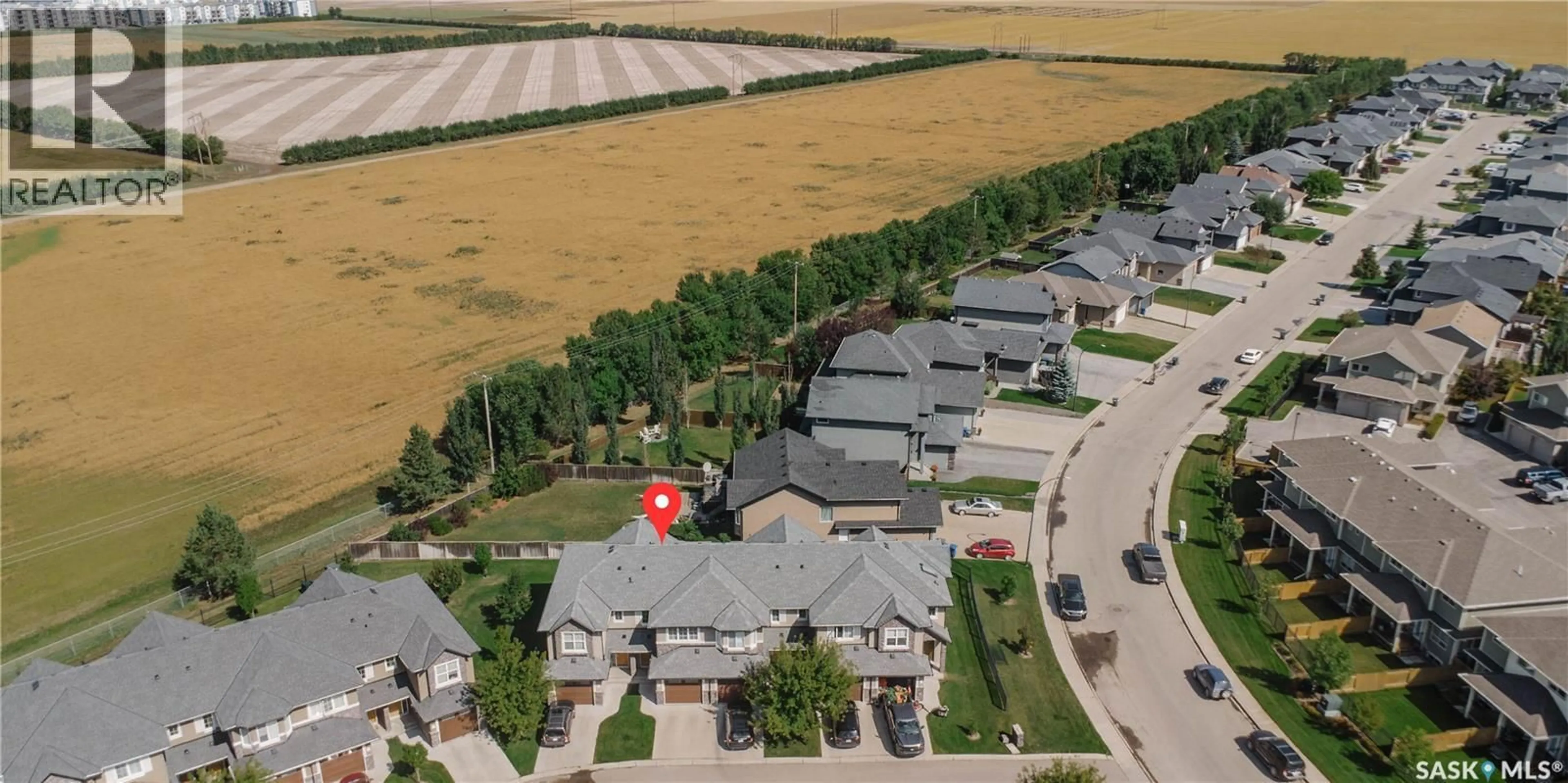 A pic from outside/outdoor area/front of a property/back of a property/a pic from drone, street for 507 1555 PATON CRESCENT, Saskatoon Saskatchewan S7W0V5