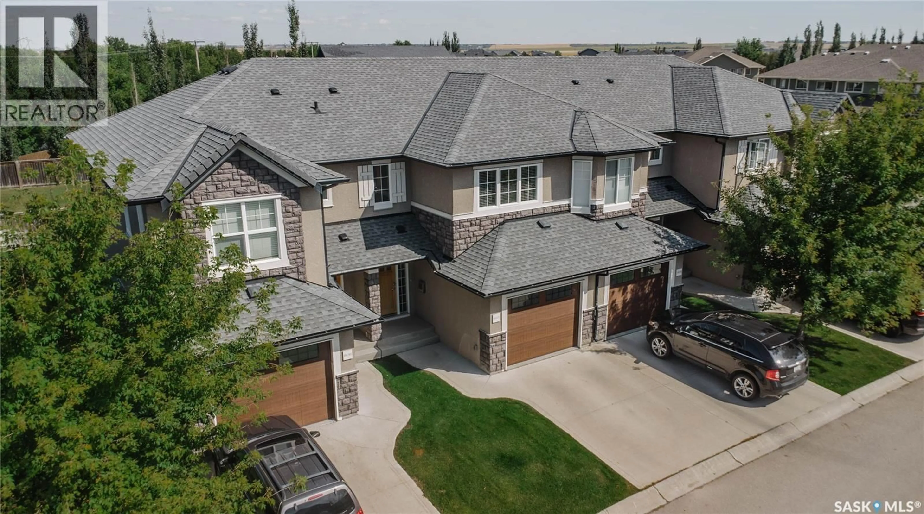 A pic from outside/outdoor area/front of a property/back of a property/a pic from drone, street for 507 1555 PATON CRESCENT, Saskatoon Saskatchewan S7W0V5