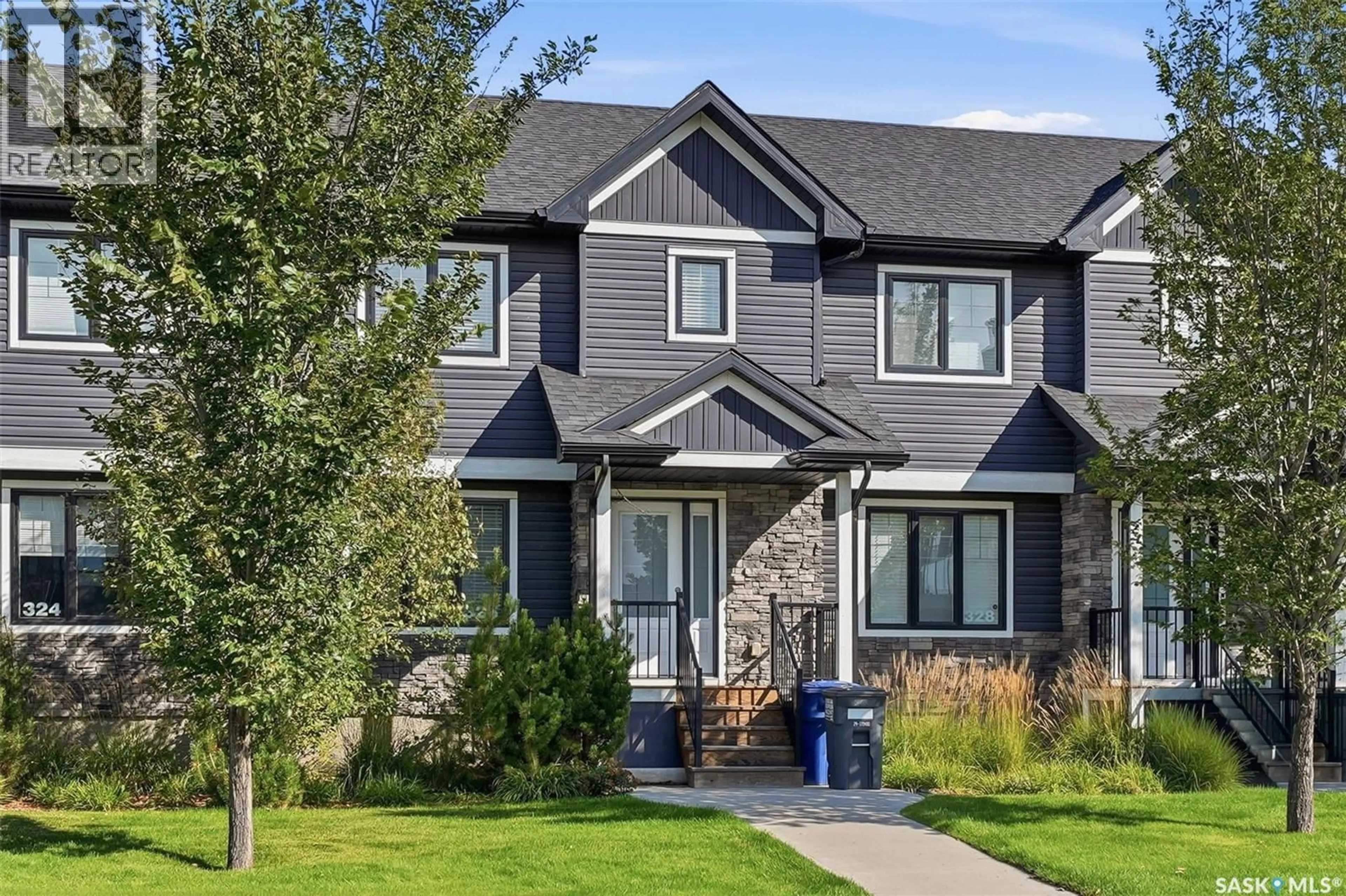 Home with vinyl exterior material, street for 326 MANINGAS BEND, Saskatoon Saskatchewan S7W0V8