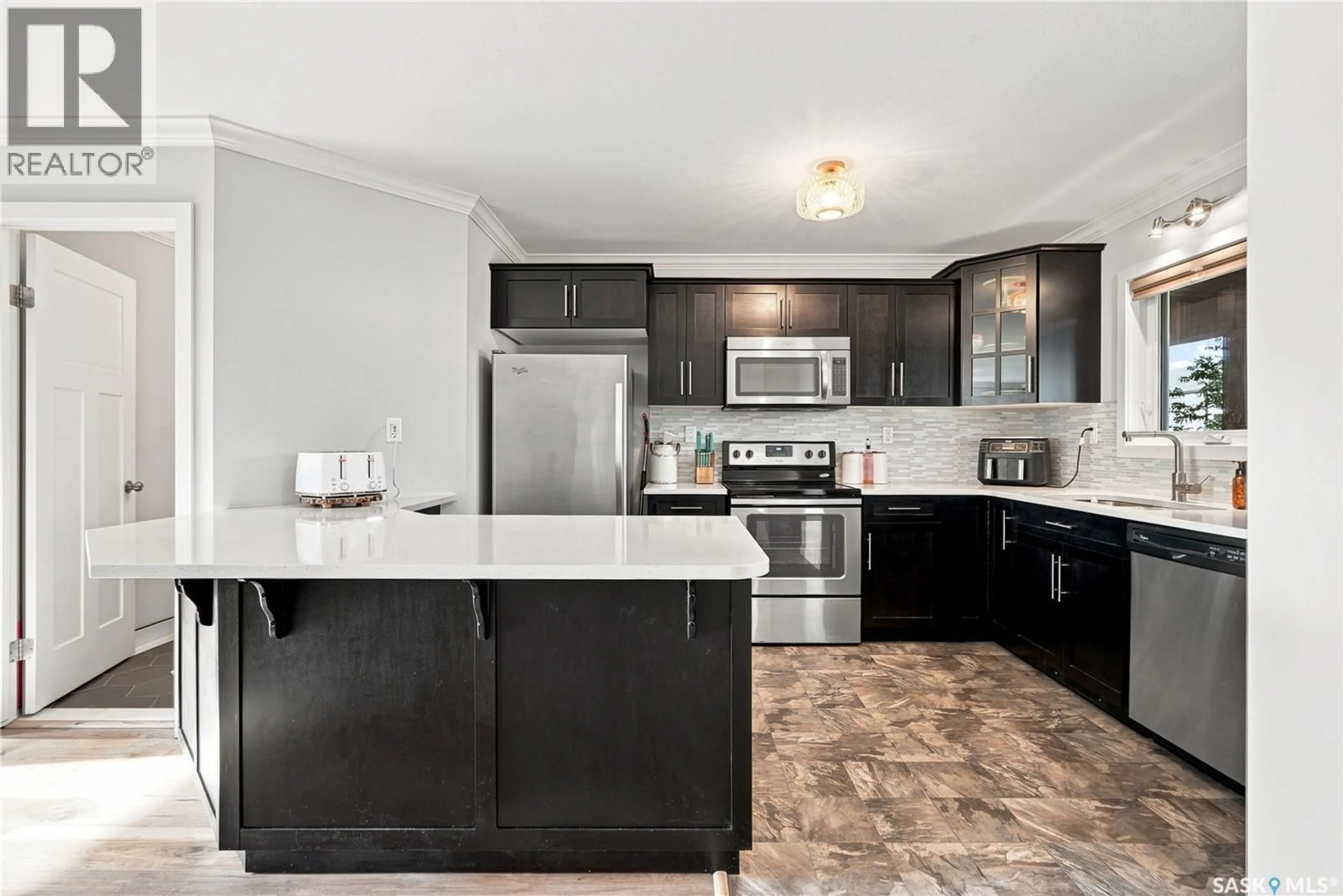 Open concept kitchen, ceramic/tile floor for 250 - 259 AKHTAR BEND, Saskatoon Saskatchewan S7W0W4