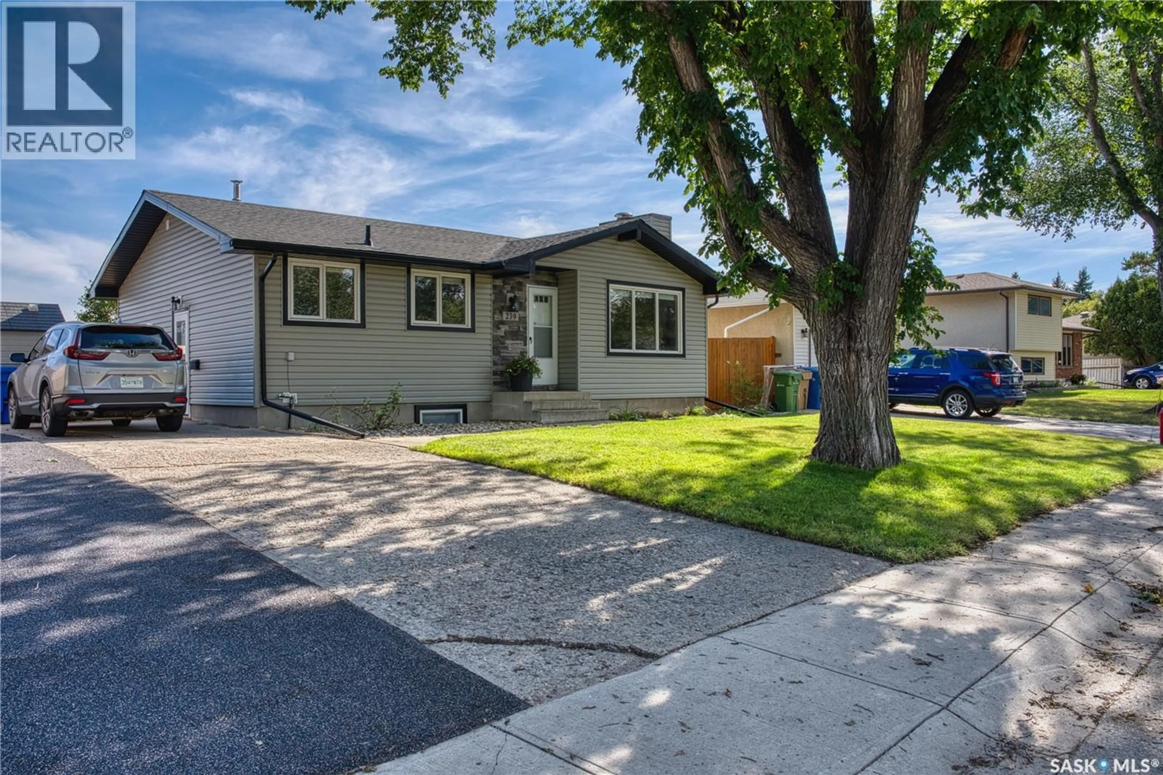 Home with vinyl exterior material, street for 239 RODENBUSH DRIVE, Regina Saskatchewan S4R6X1