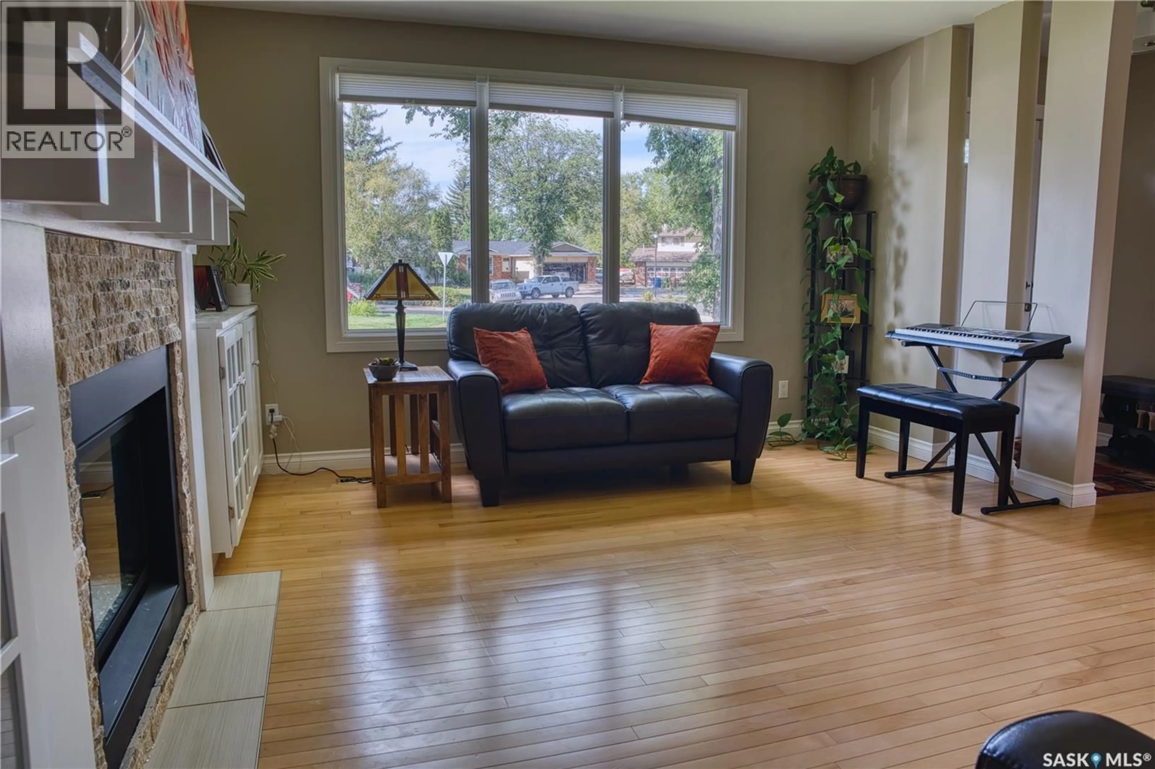 Living room with furniture, wood/laminate floor for 239 RODENBUSH DRIVE, Regina Saskatchewan S4R6X1