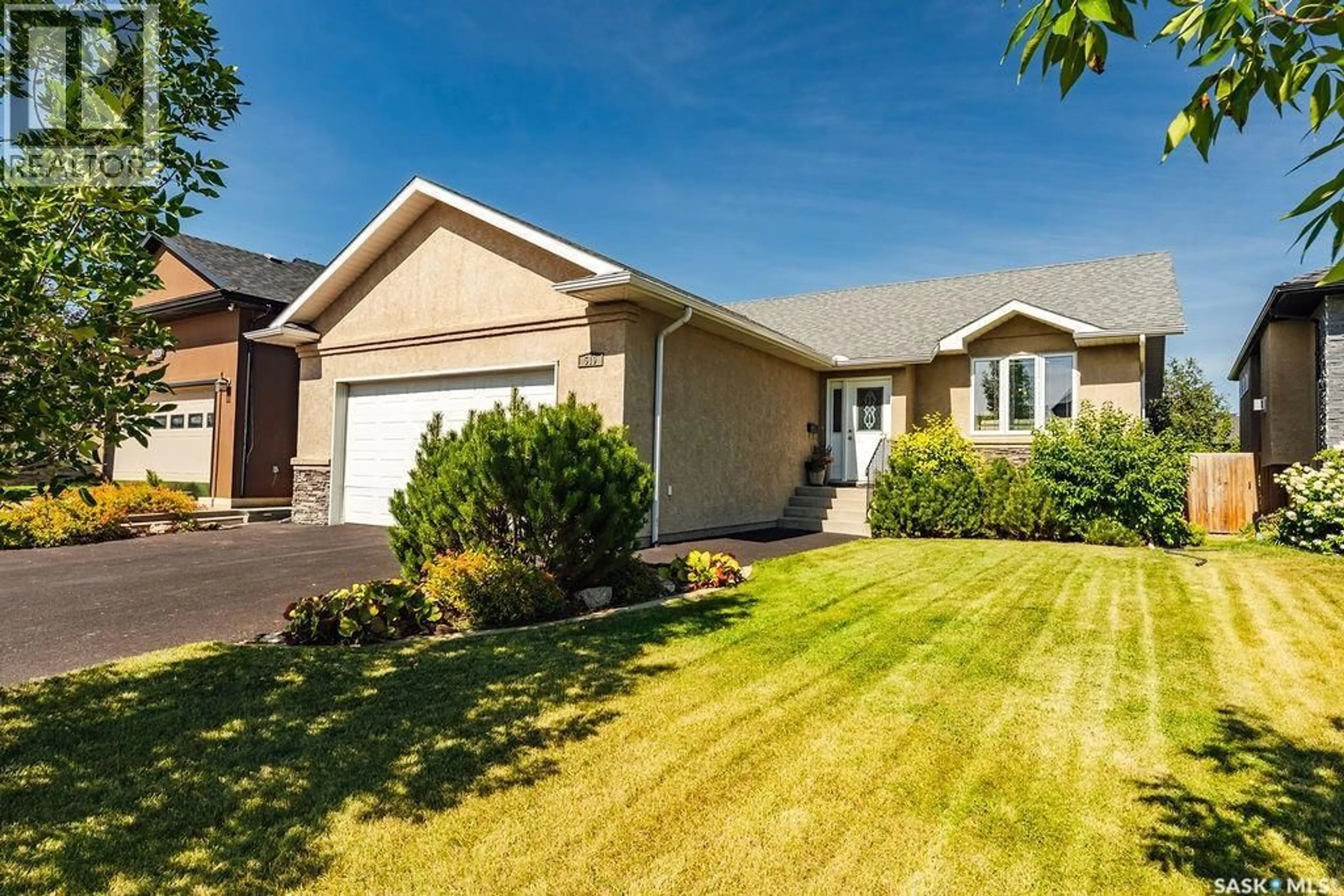 Home with vinyl exterior material, street for 519 SHEPHERD CRESCENT, Saskatoon Saskatchewan S7N4K5