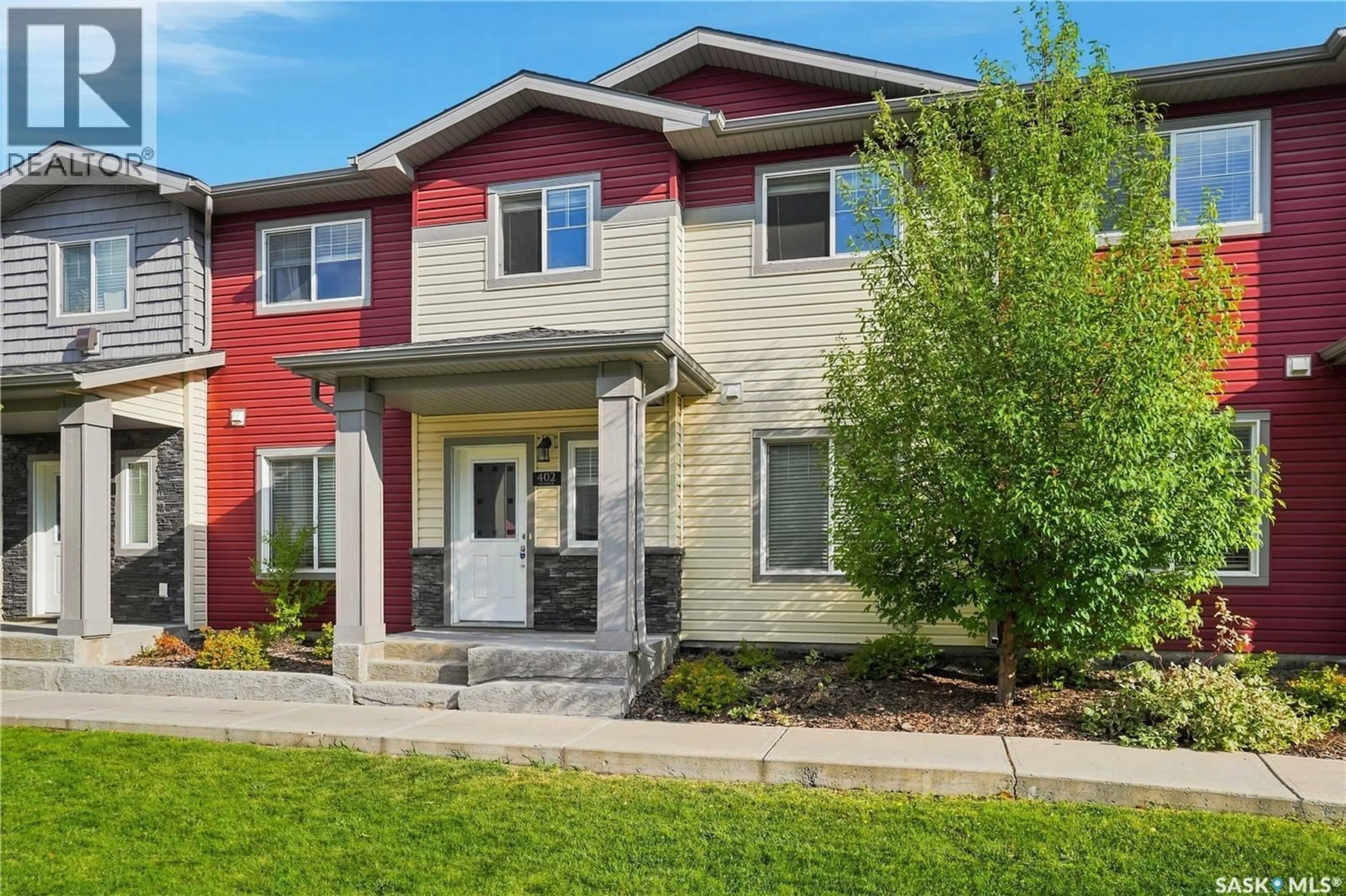 Home with brick exterior material, street for 402 - 3440 AVONHURST DRIVE, Regina Saskatchewan S4R2E1