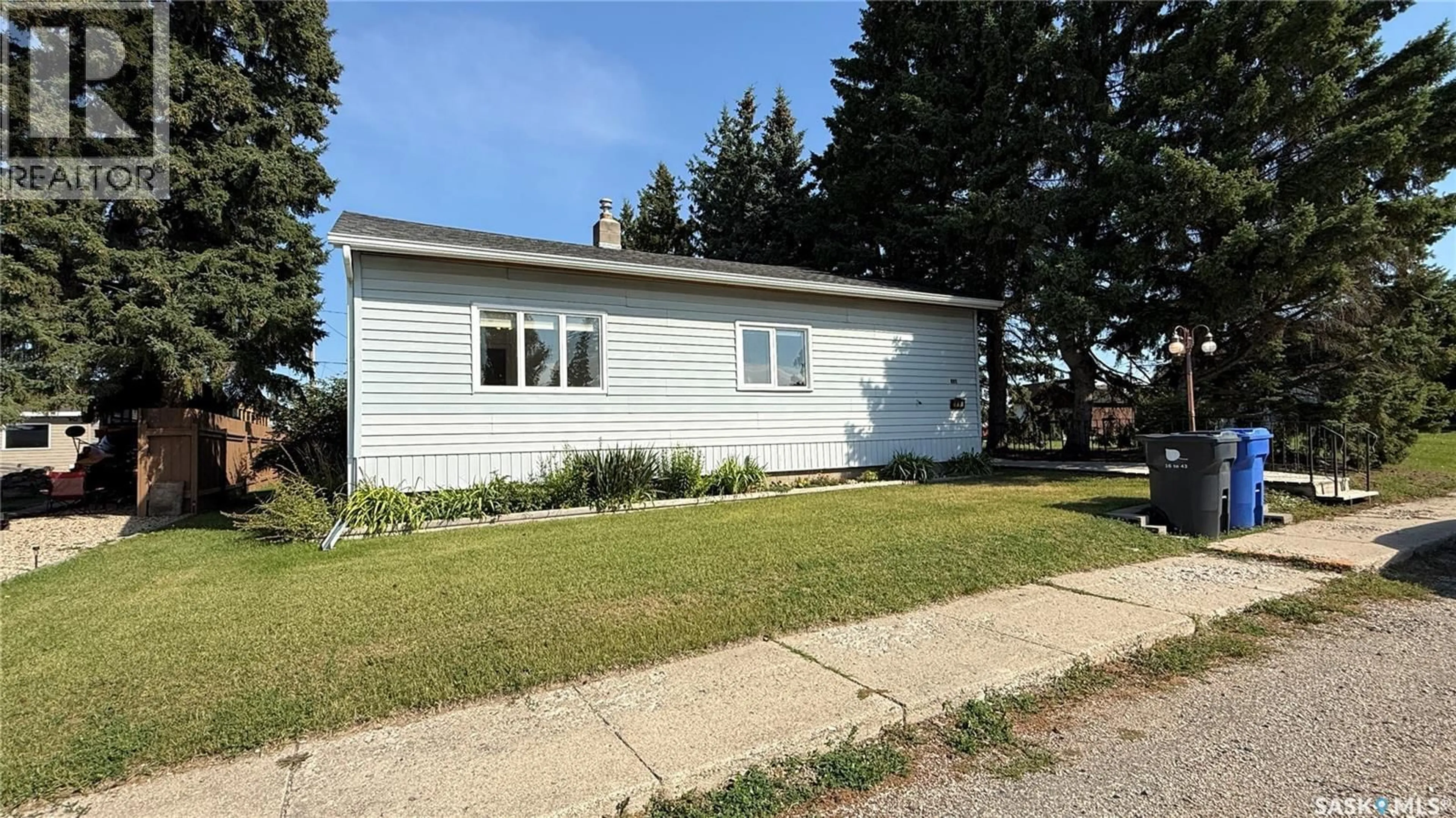 Home with vinyl exterior material, street for 110 1ST AVENUE, Hafford Saskatchewan S0J1A0