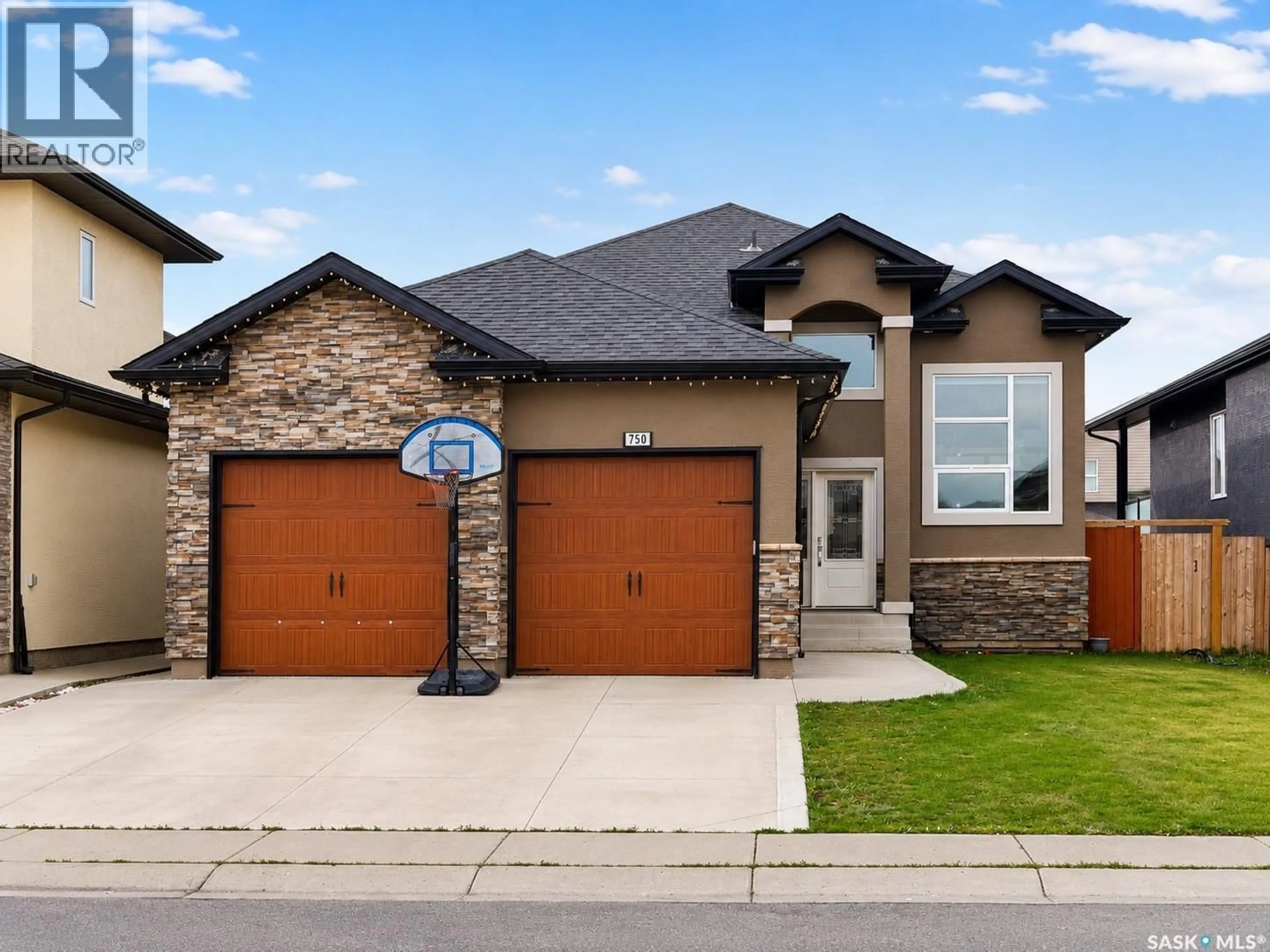Home with brick exterior material, street for 750 LABINE COURT, Saskatoon Saskatchewan S7L6C8