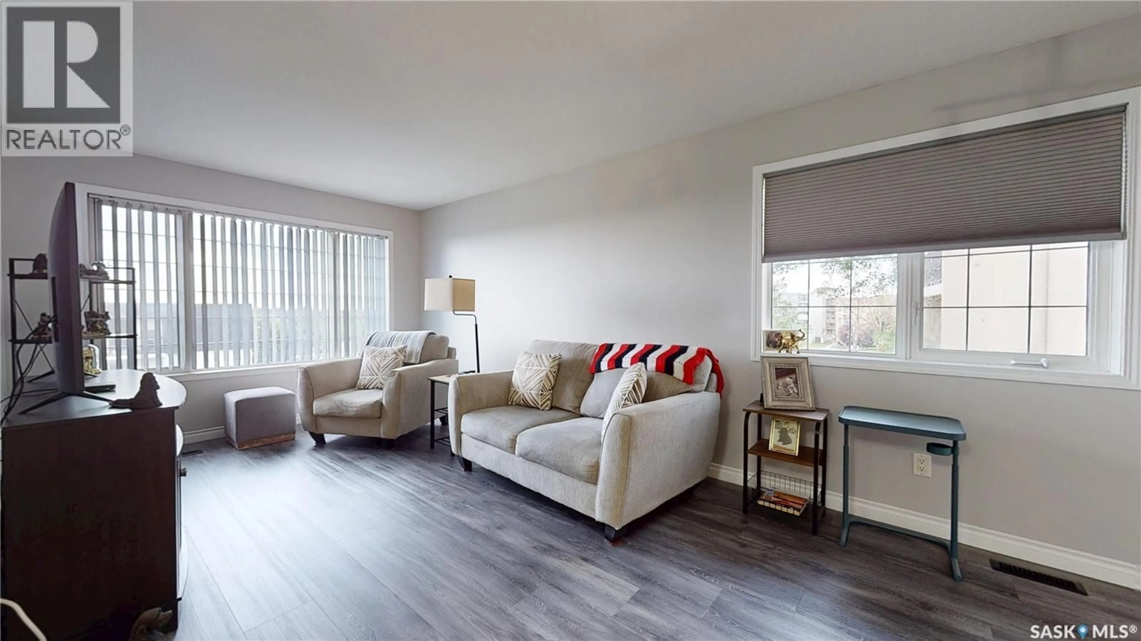 Living room with furniture, wood/laminate floor for 404 28 KLEISINGER CRESCENT, Regina Saskatchewan S4R8T8