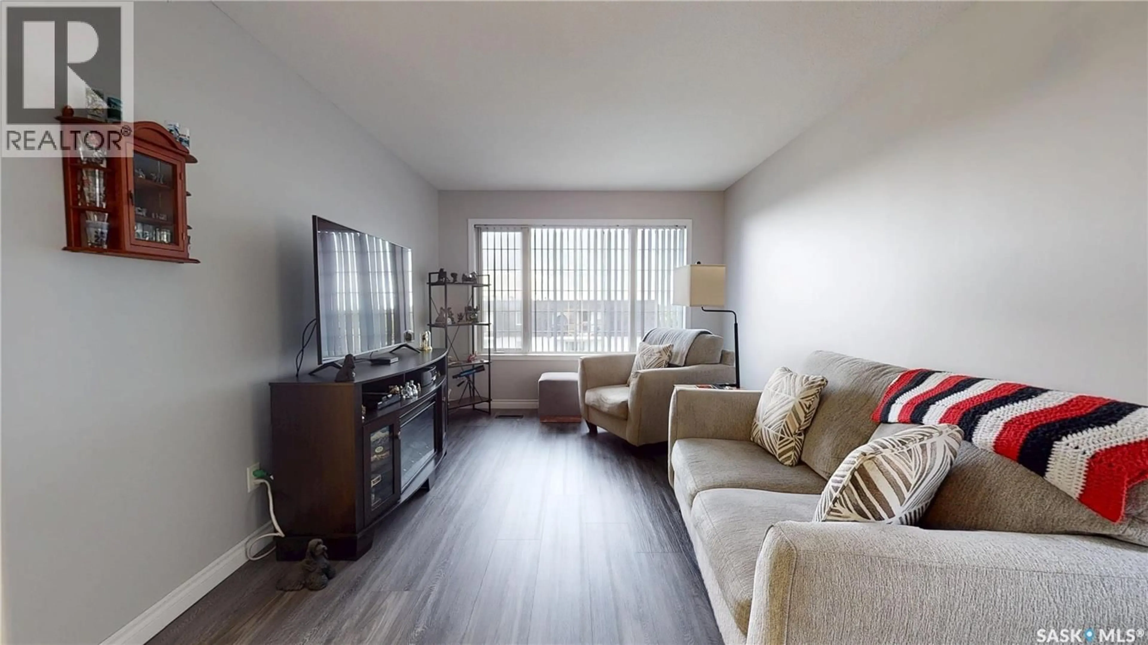 Living room with furniture, wood/laminate floor for 404 28 KLEISINGER CRESCENT, Regina Saskatchewan S4R8T8