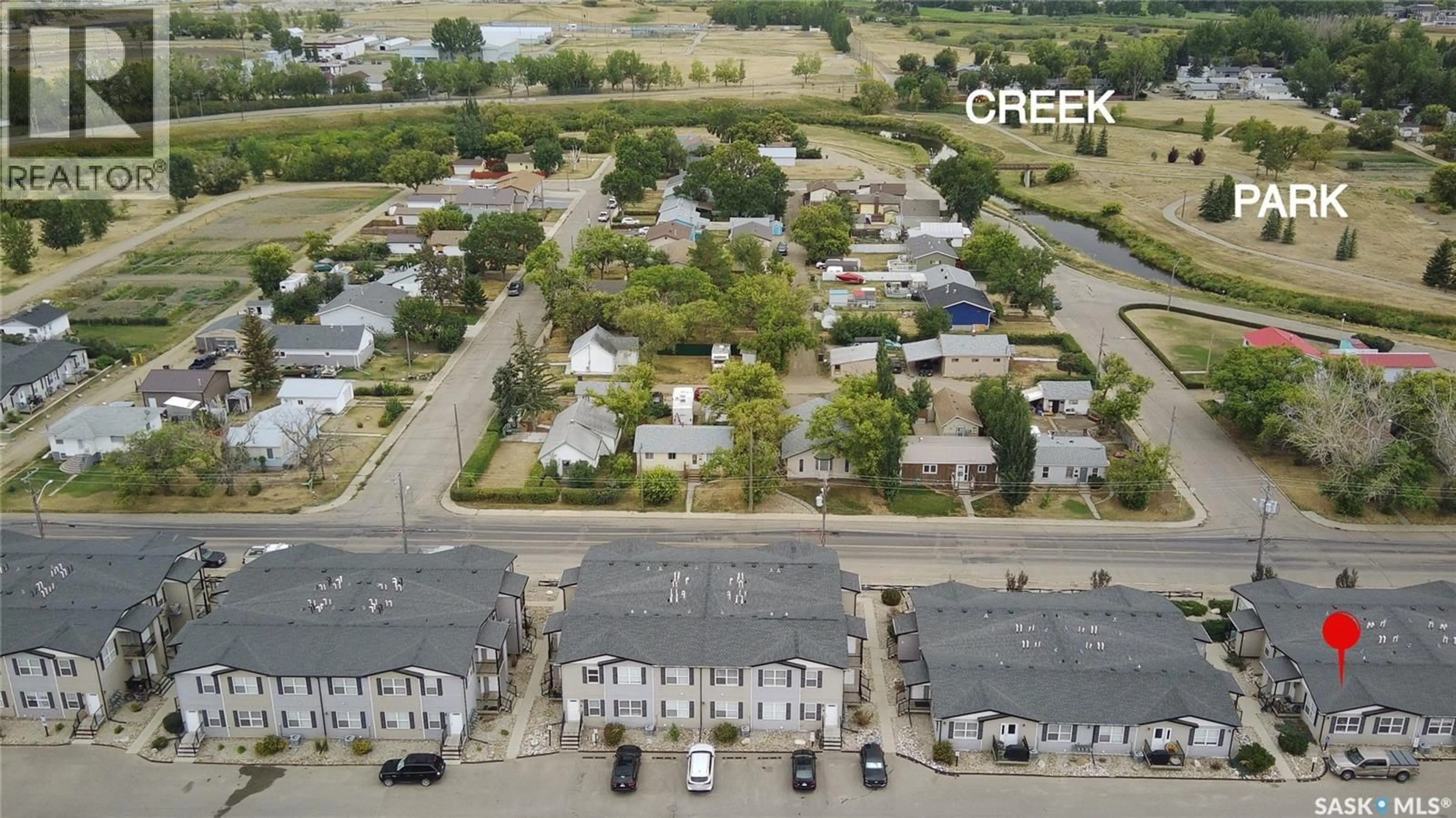 A pic from outside/outdoor area/front of a property/back of a property/a pic from drone, street for 12 - 1275 SOUTH RAILWAY AVENUE, Swift Current Saskatchewan S9H5P3