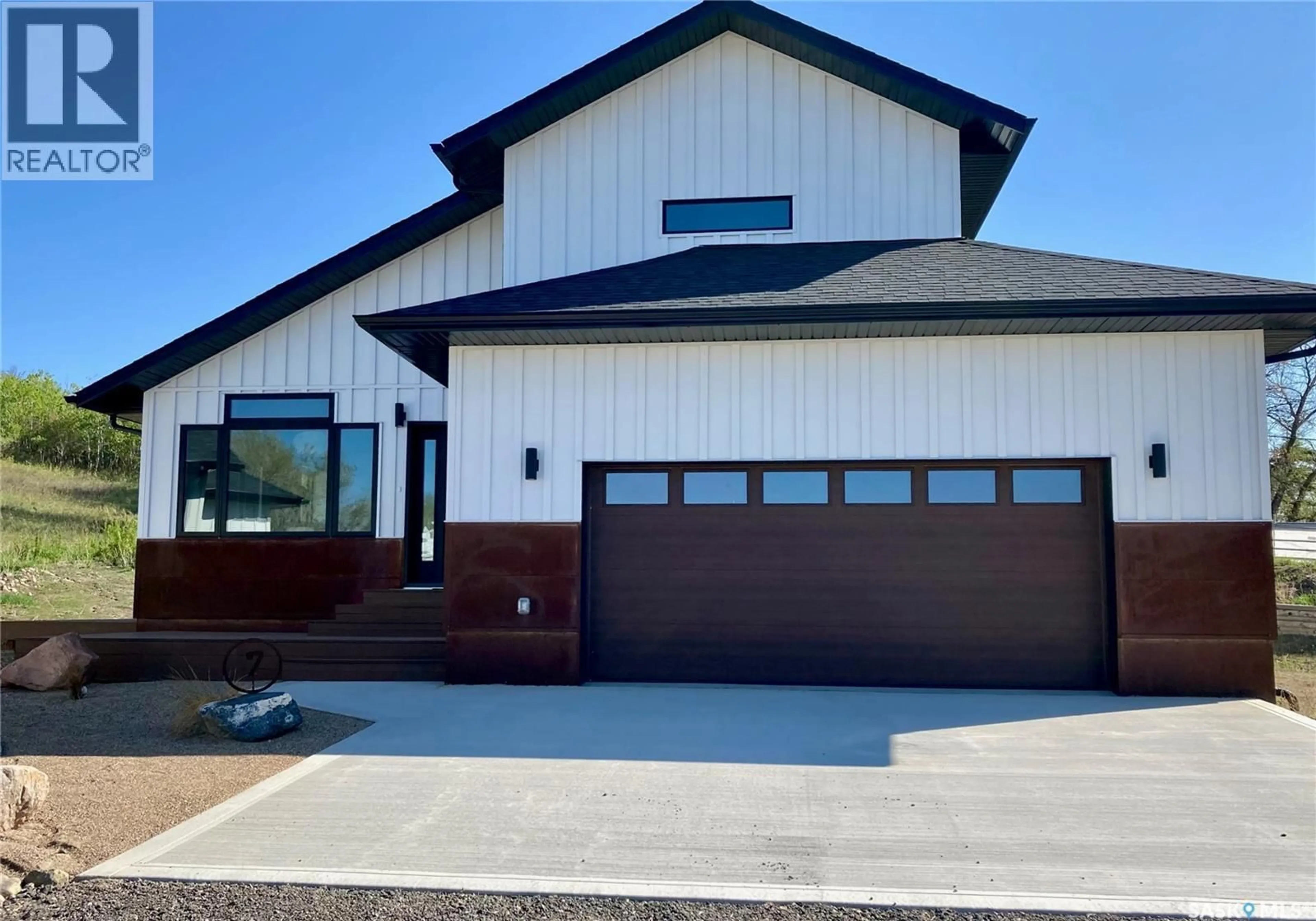 Home with vinyl exterior material, street for 7 70 8TH AVENUE, Lumsden Saskatchewan S0G3C0