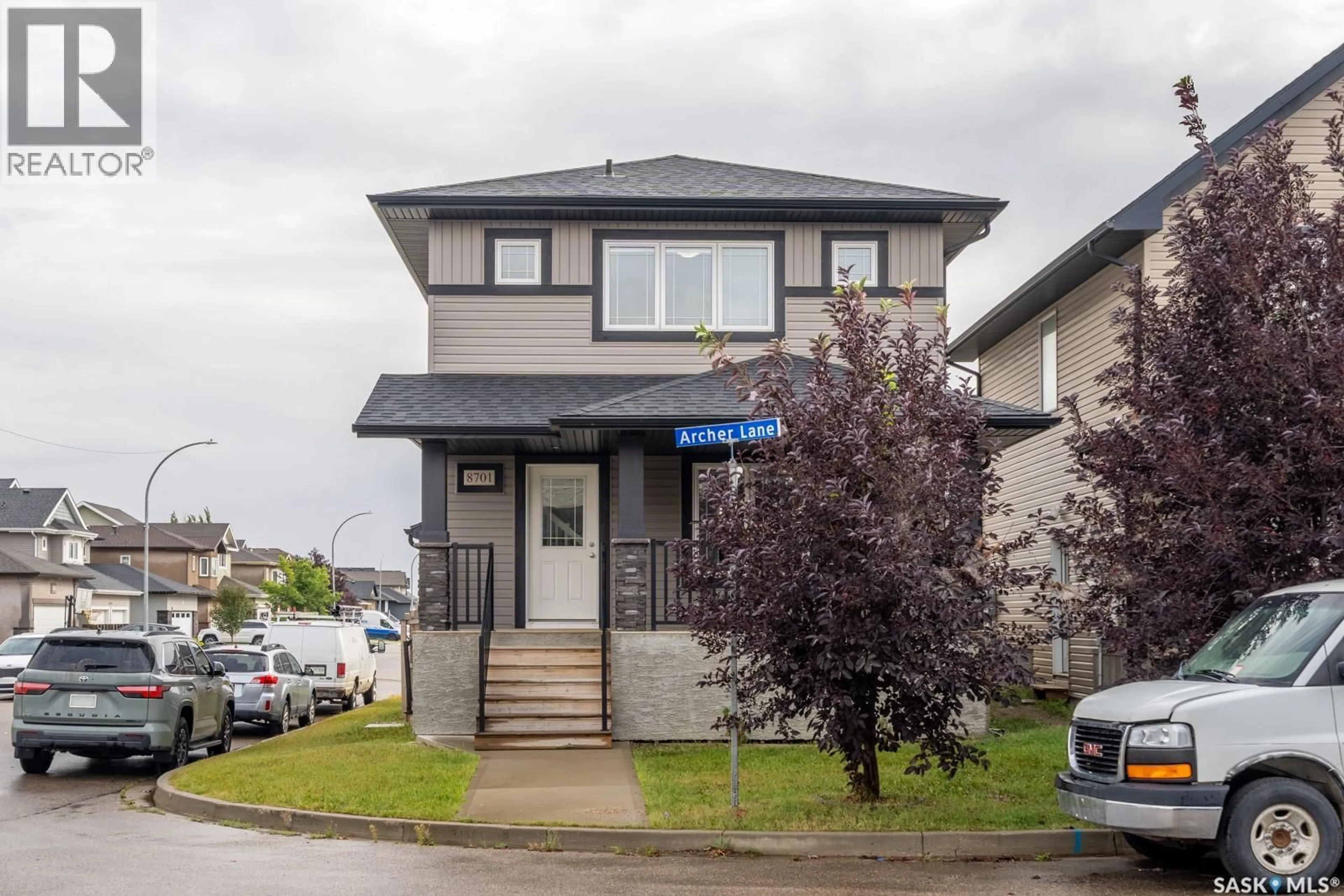 Home with vinyl exterior material, street for 8701 ARCHER LANE, Regina Saskatchewan S4Y1A3