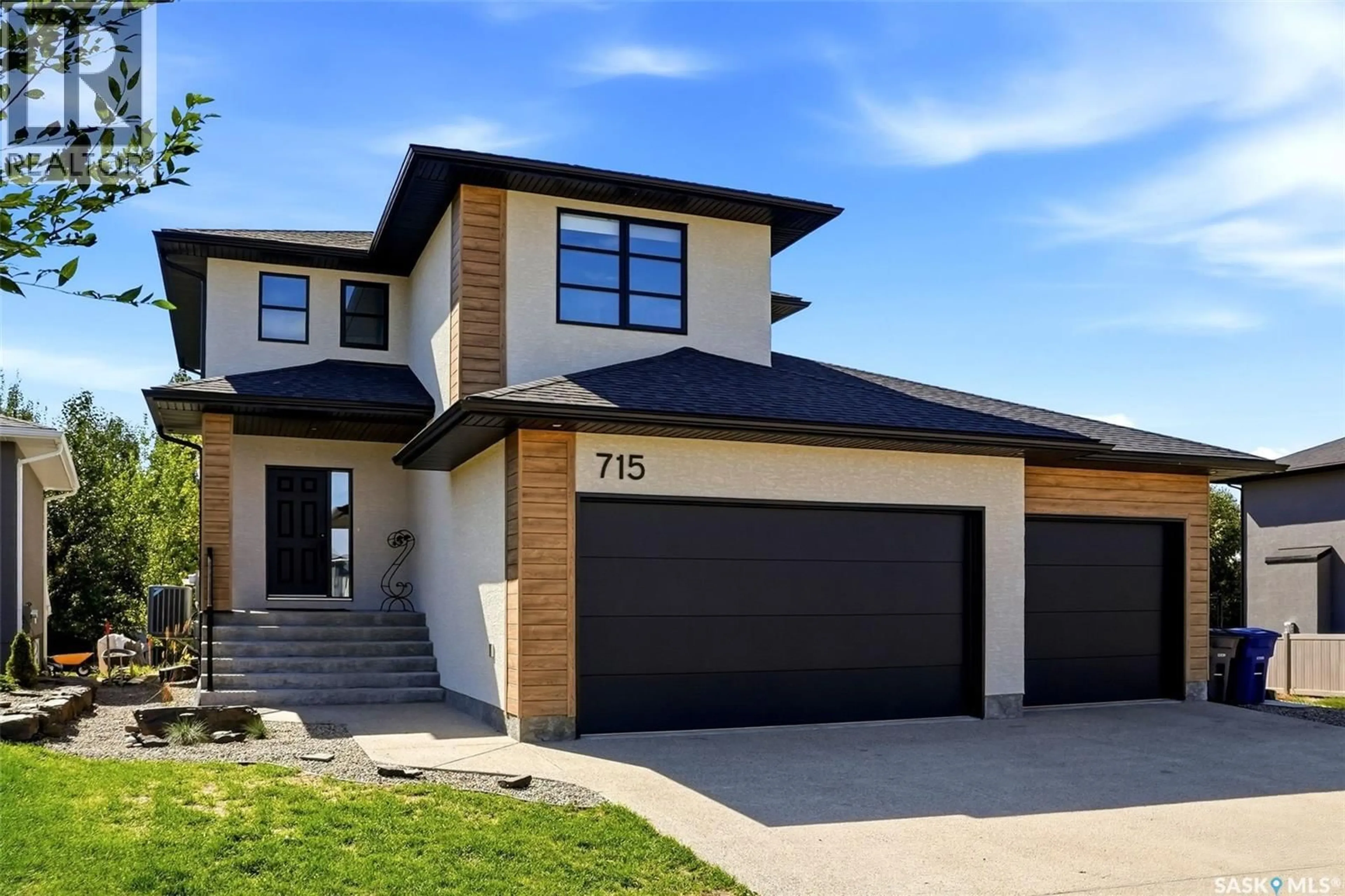 Home with brick exterior material, street for 715 3RD AVENUE, Pilot Butte Saskatchewan S0G3Z0