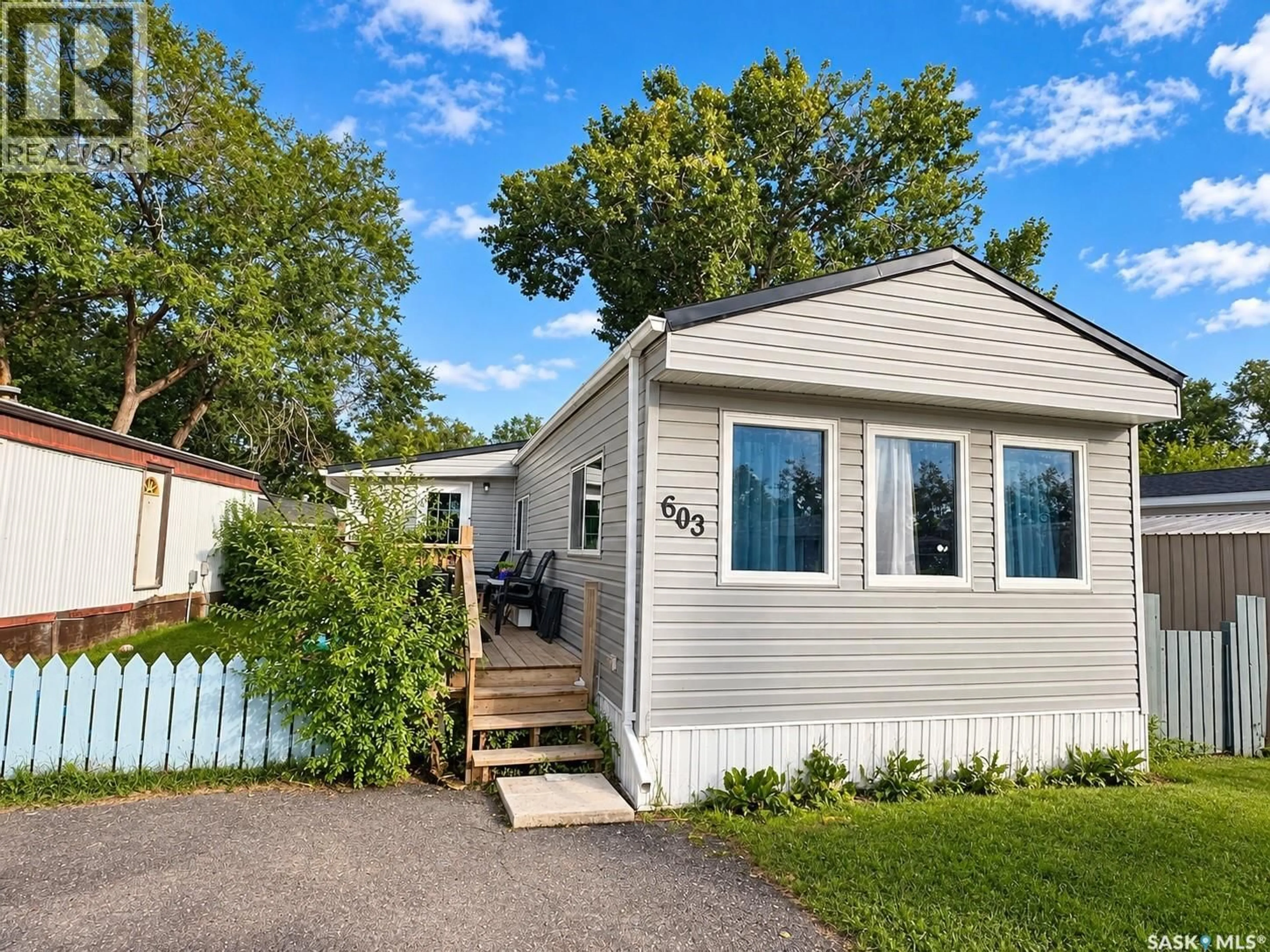 Home with vinyl exterior material, street for 603 1524 RAYNER AVENUE, Saskatoon Saskatchewan S7N1Y1