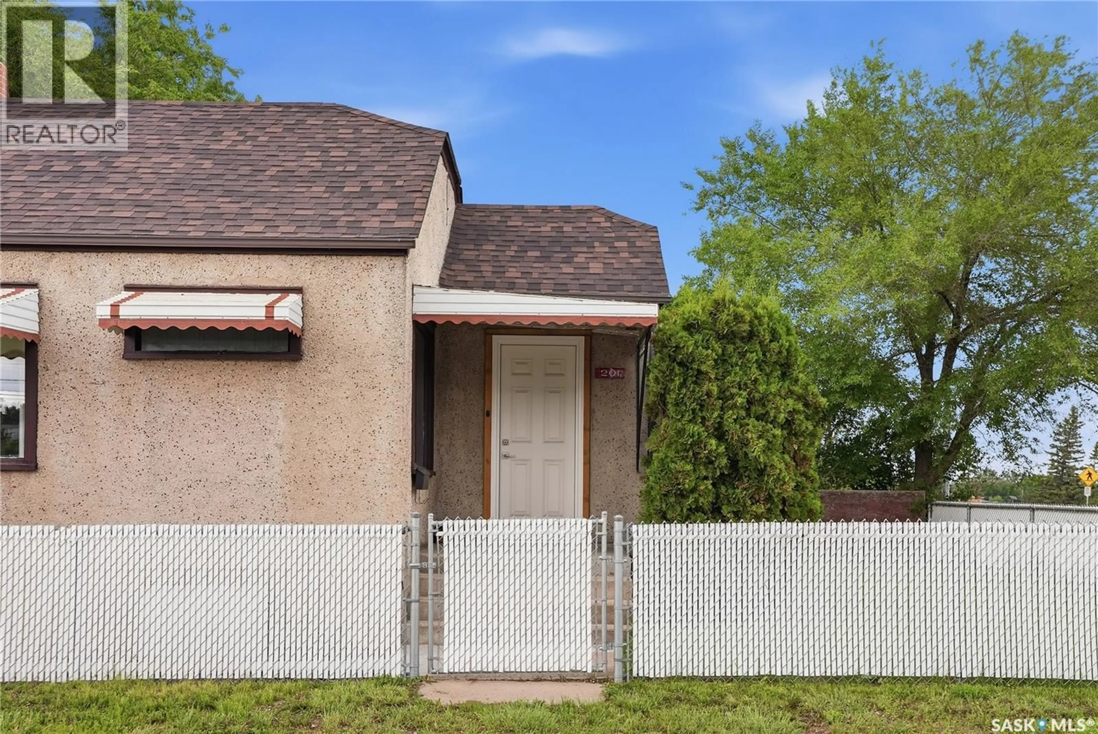 Home with vinyl exterior material, street for 201 P AVENUE N, Saskatoon Saskatchewan S7L2V6