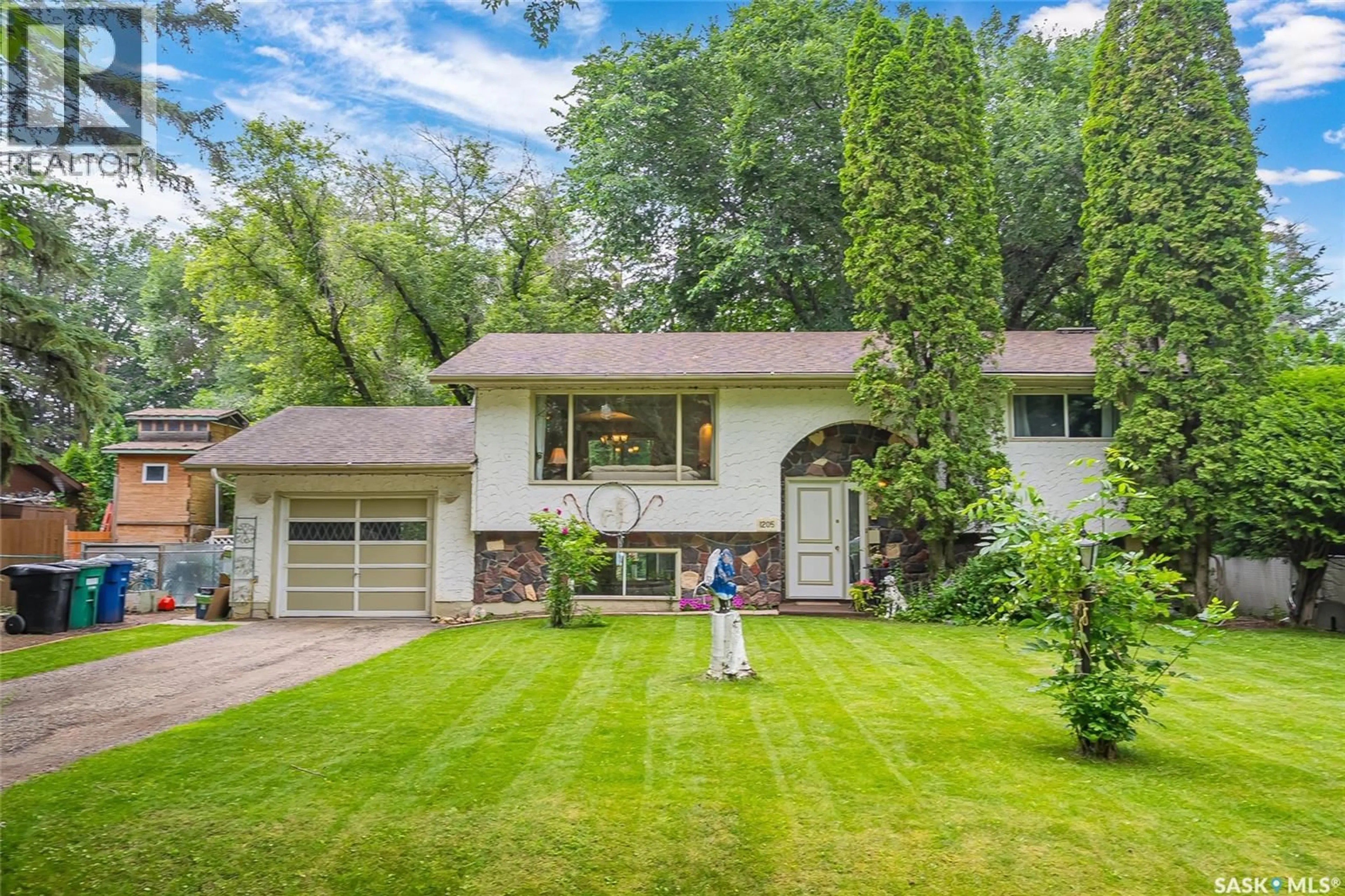 Home with vinyl exterior material, street for 1205 HAIDA AVENUE, Saskatoon Saskatchewan S7M4N2