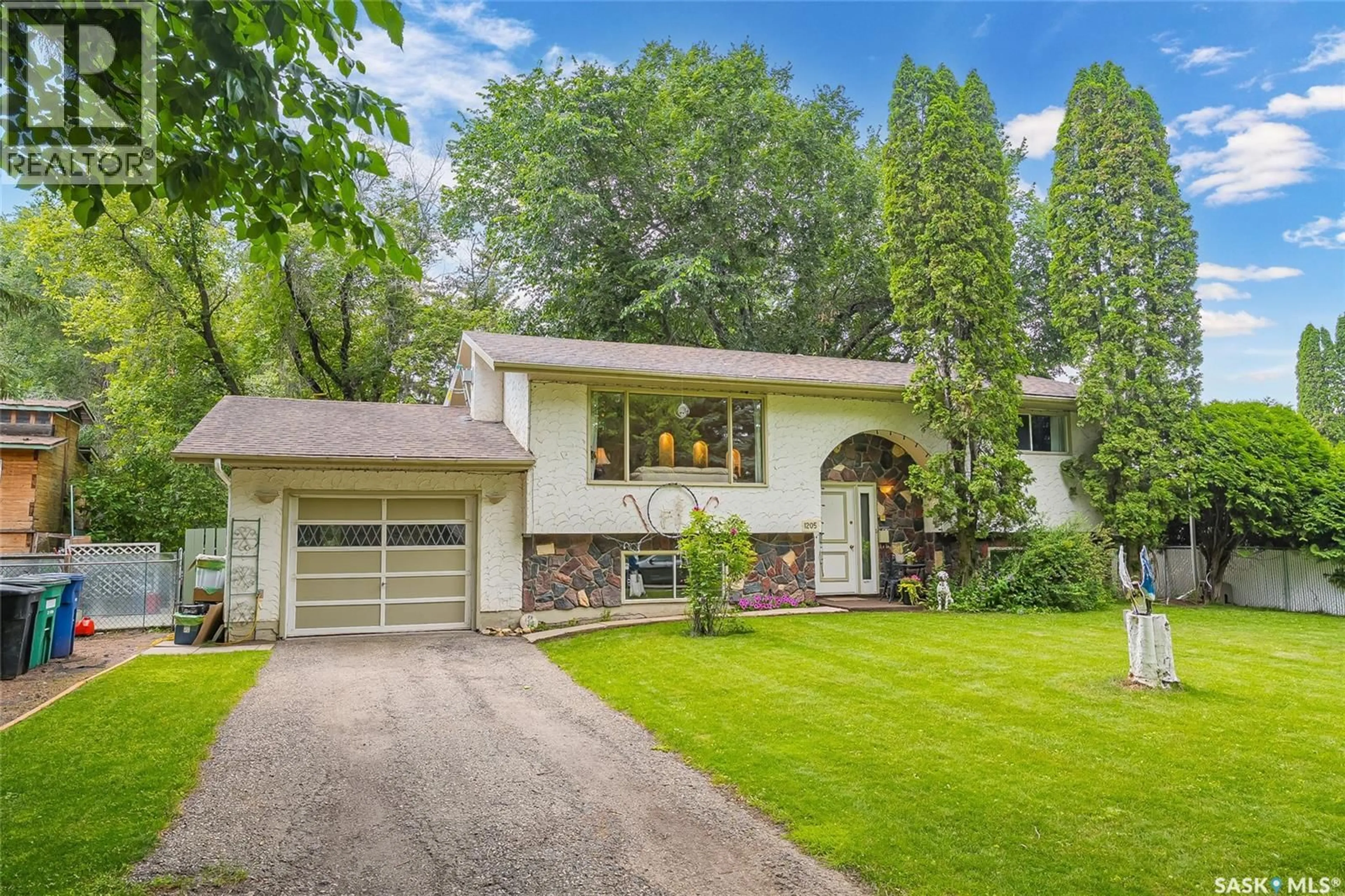 Home with vinyl exterior material, street for 1205 HAIDA AVENUE, Saskatoon Saskatchewan S7M4N2