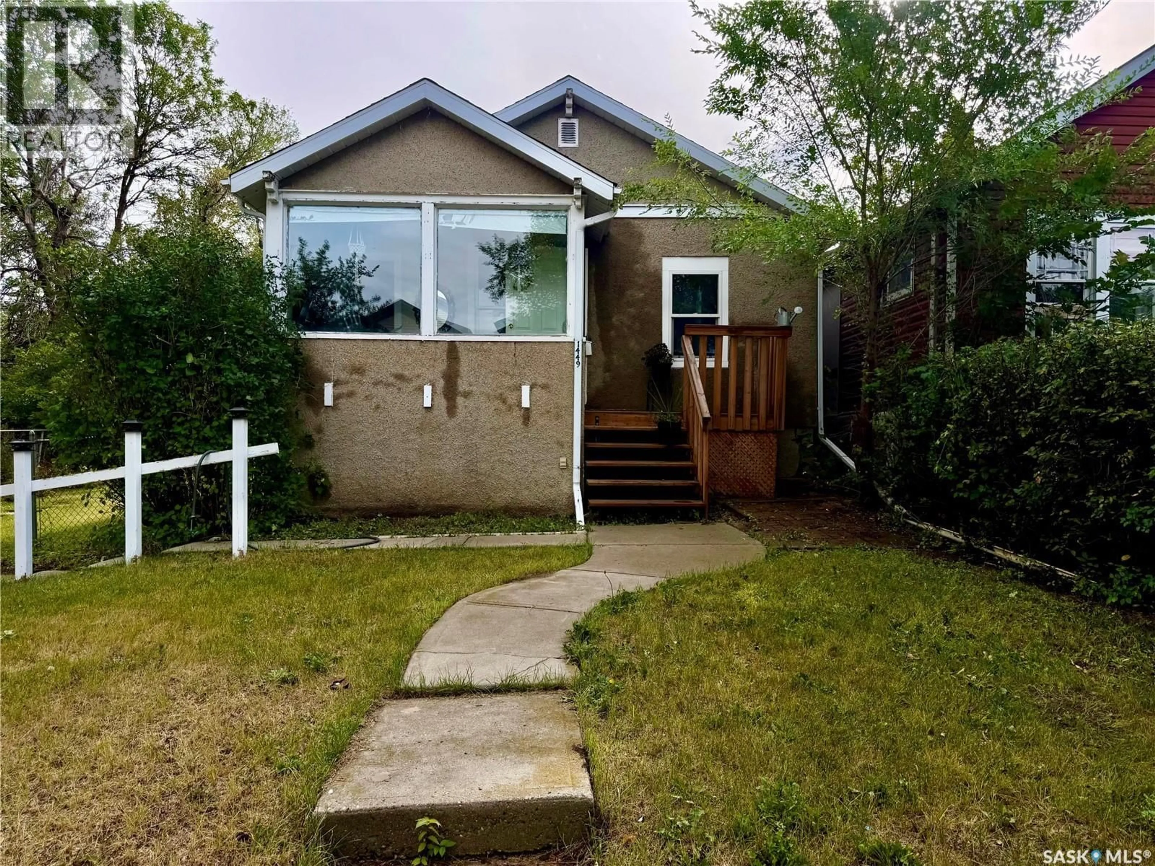 Home with vinyl exterior material, street for 1449 MCINTOSH STREET, Regina Saskatchewan S4T5C4