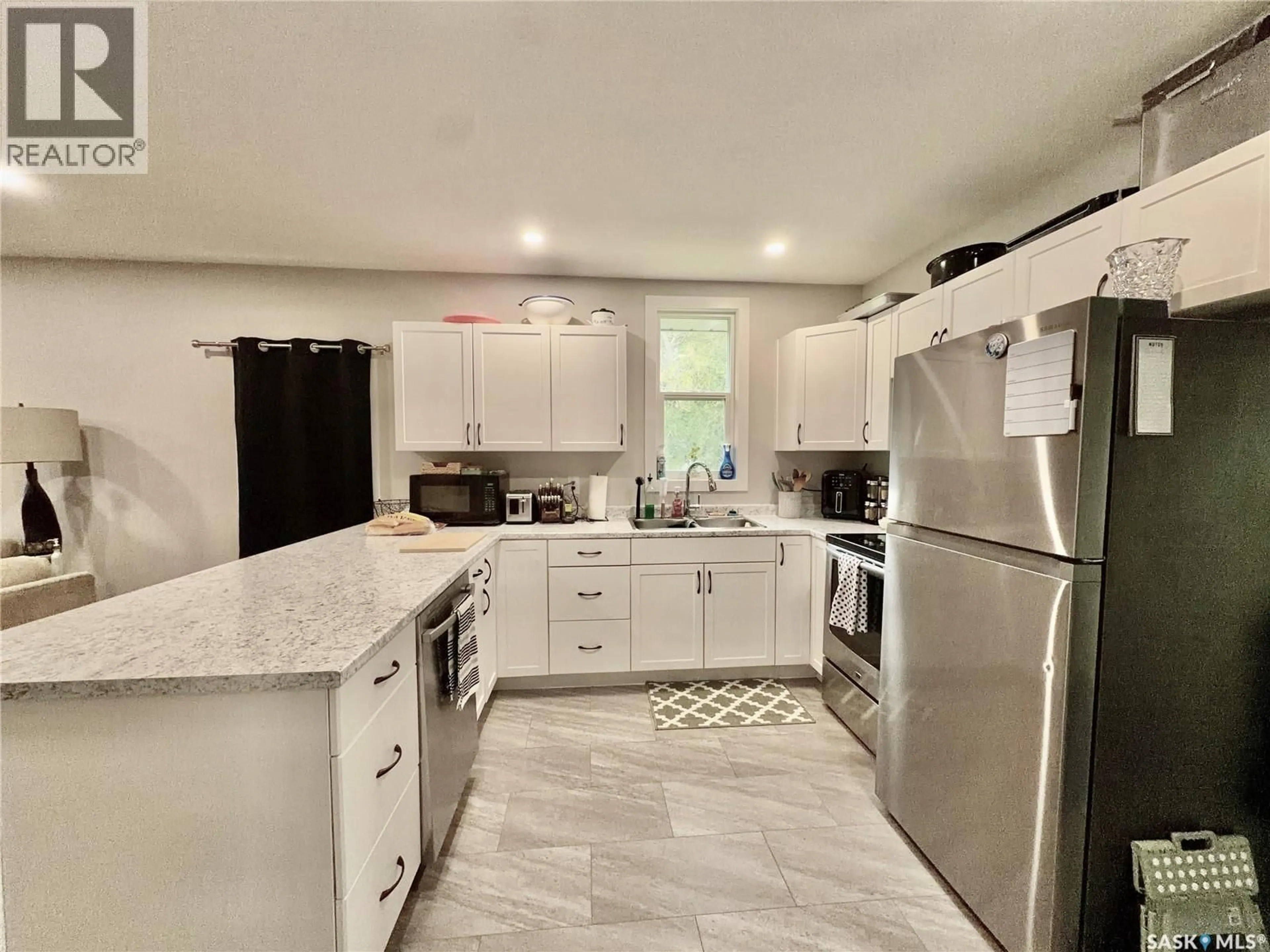 Open concept kitchen, ceramic/tile floor for 1449 MCINTOSH STREET, Regina Saskatchewan S4T5C4