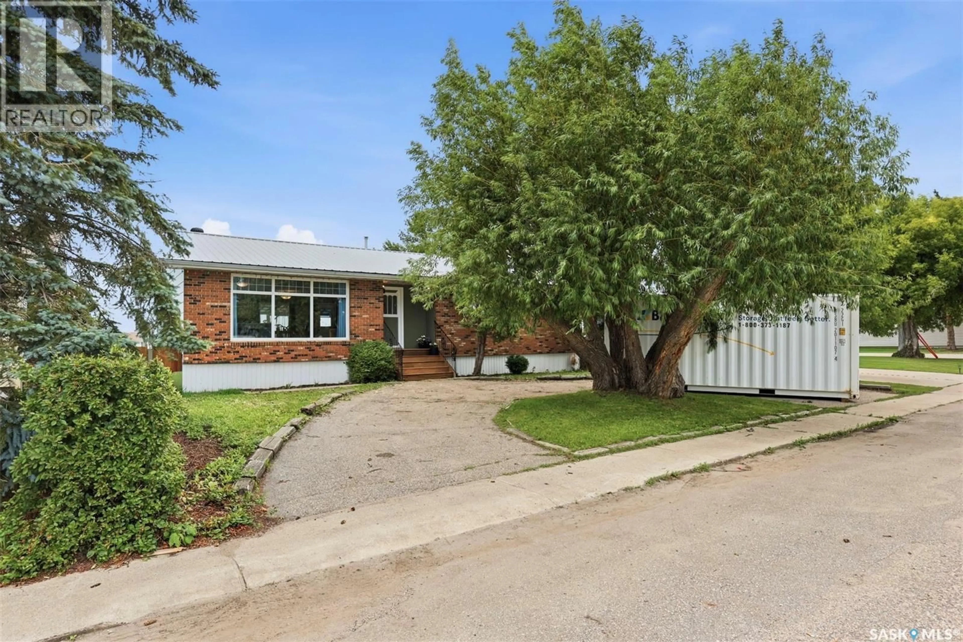 Home with brick exterior material, street for 304 4TH AVENUE, Langham Saskatchewan S0K2L0