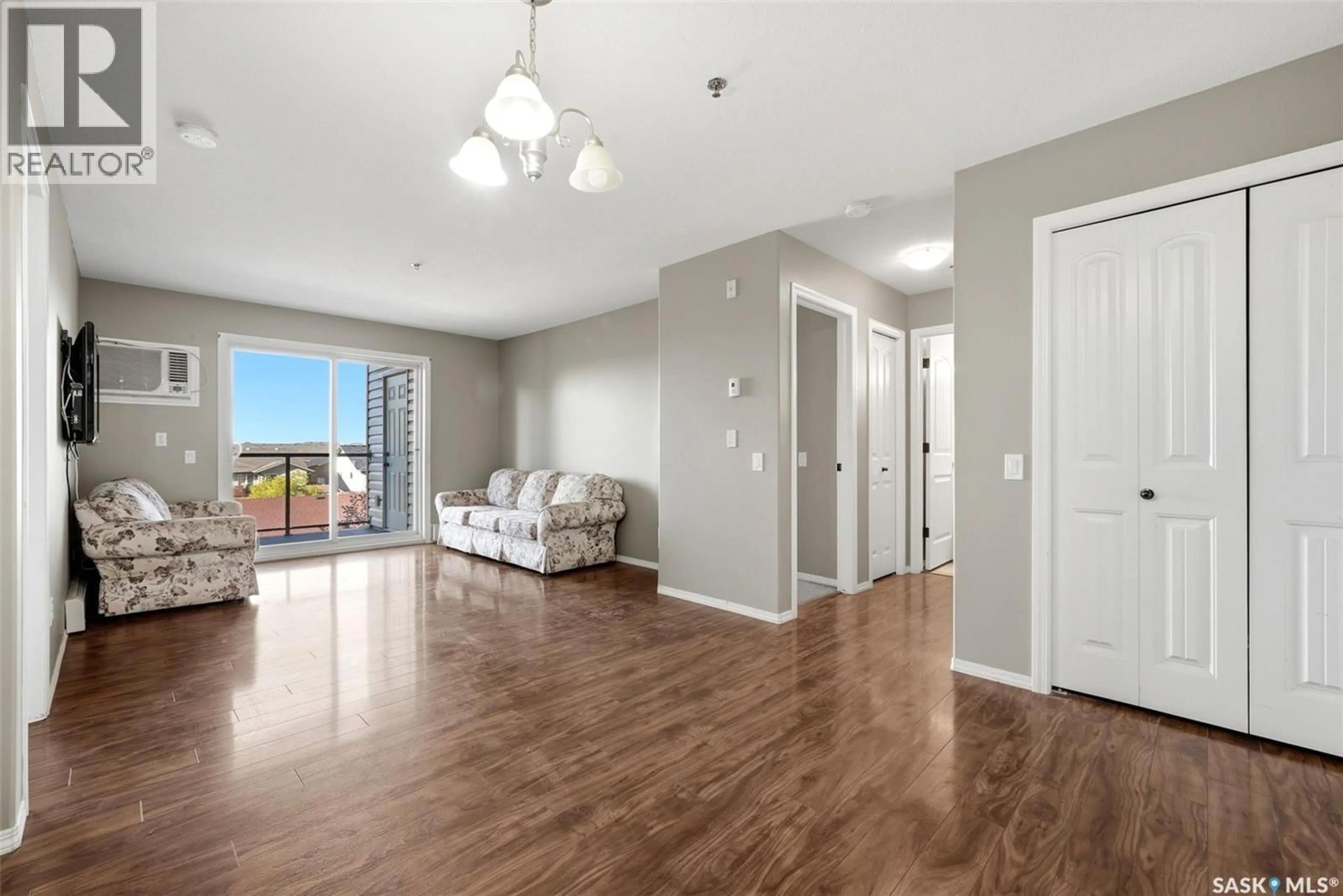 Living room with furniture, wood/laminate floor for 309 E 1300 STOCKTON STREET, Regina Saskatchewan S4X0G1
