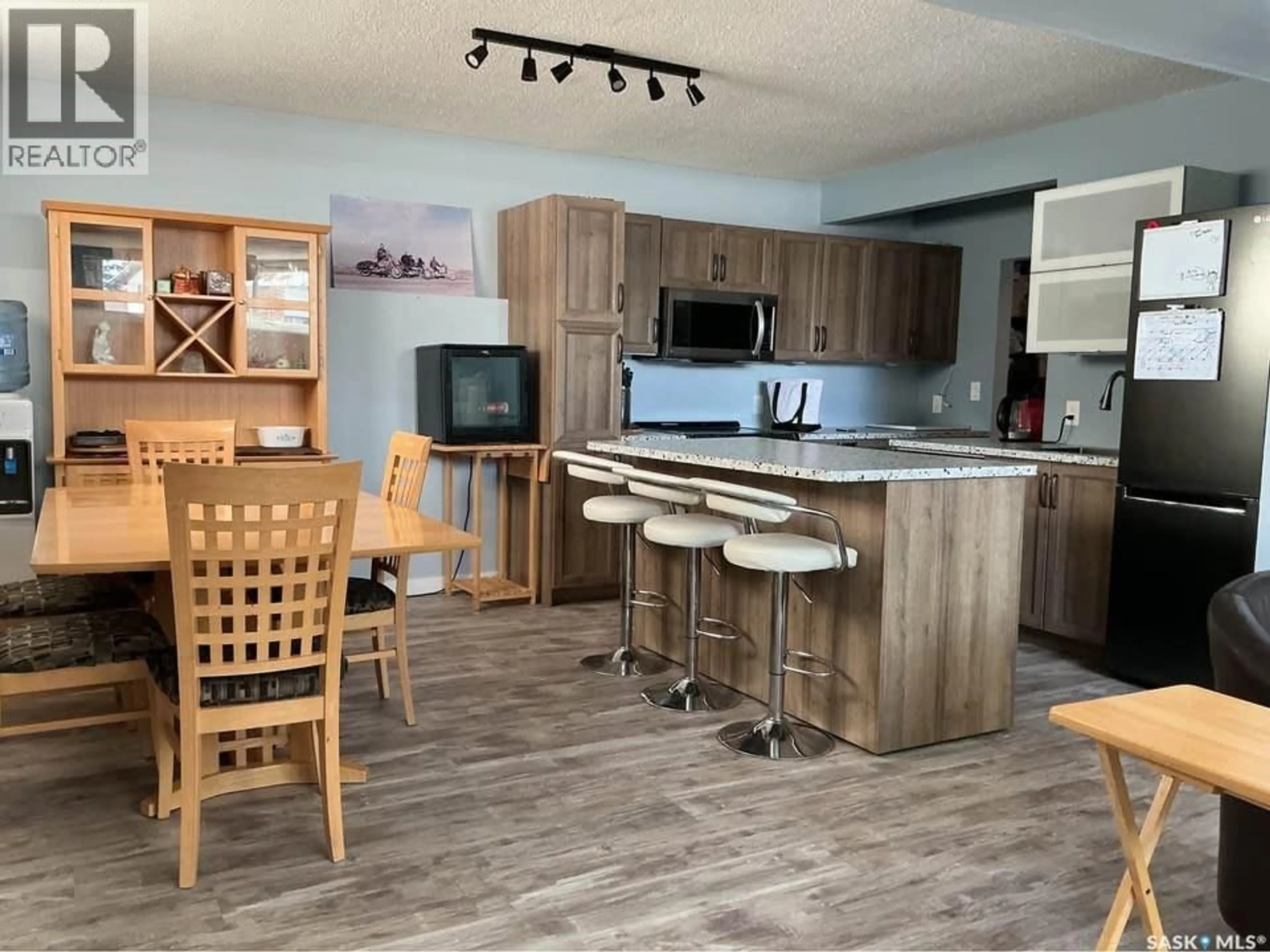 Open concept kitchen, wood/laminate floor for 1617 RUTH STREET, Saskatoon Saskatchewan S7J0L7
