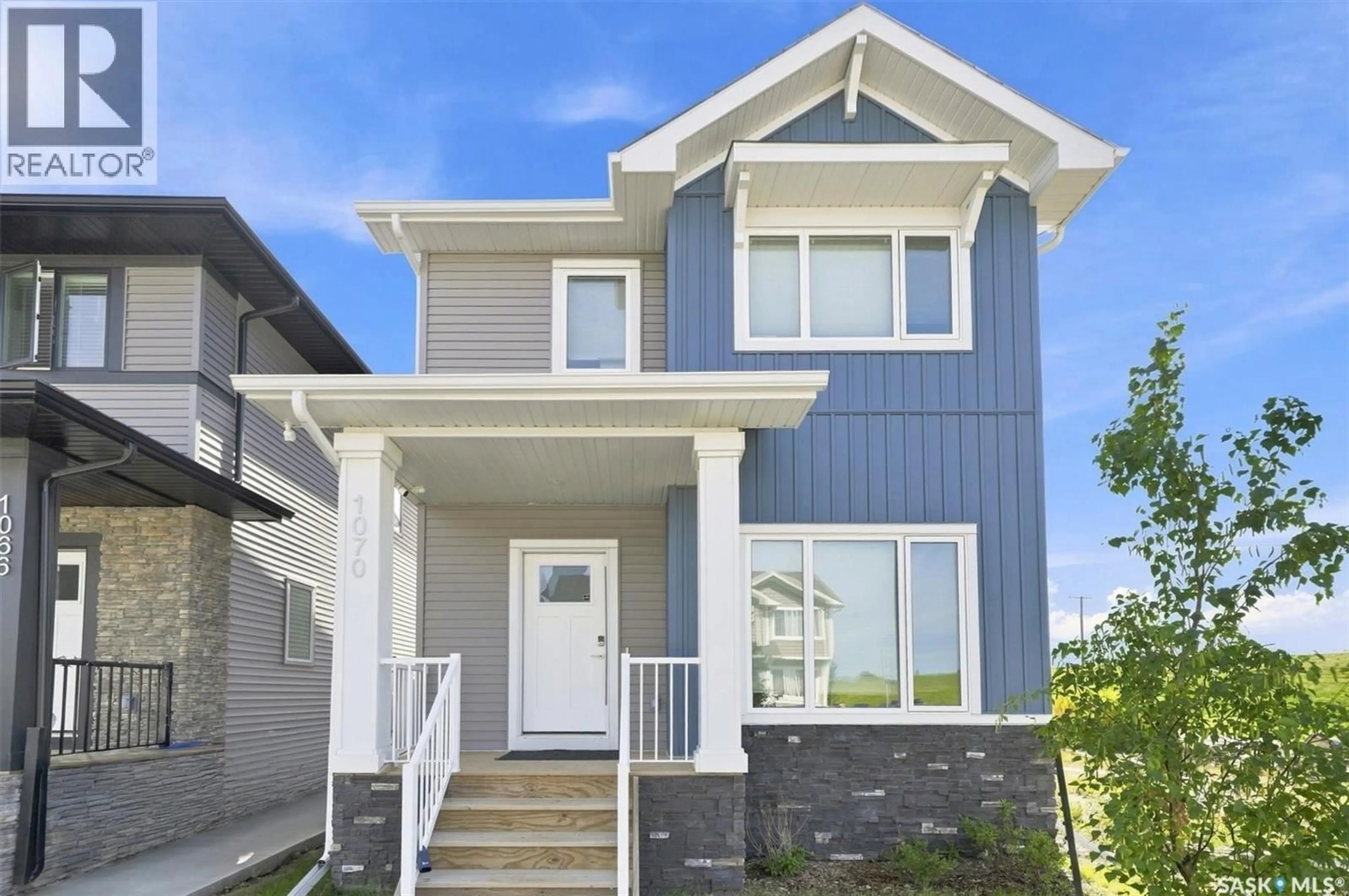Home with vinyl exterior material, street for 1070 BRIGHTON BOULEVARD, Saskatoon Saskatchewan S7V0P1