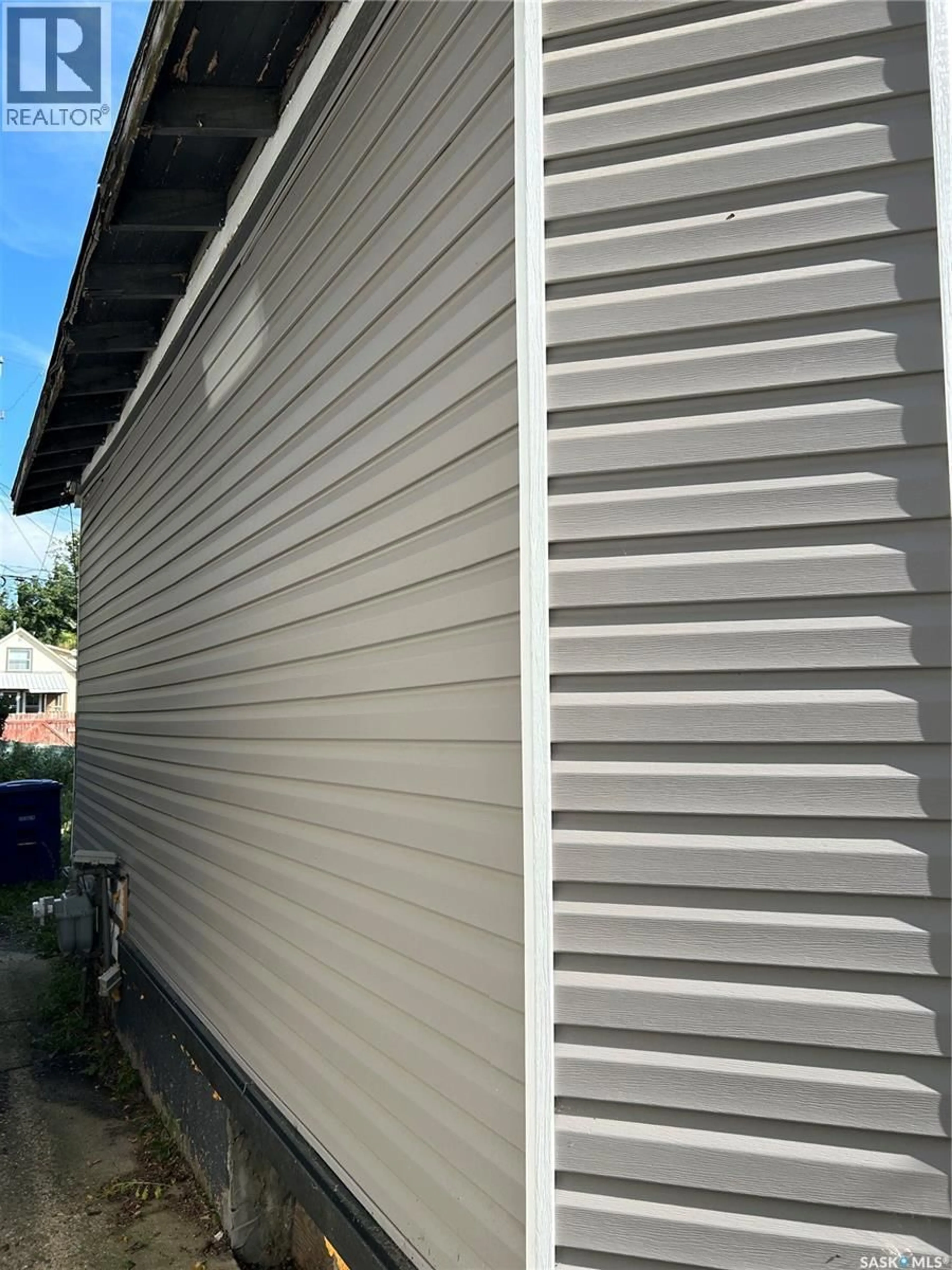 Home with vinyl exterior material, street for 1228 G AVENUE, Saskatoon Saskatchewan S7L2A4