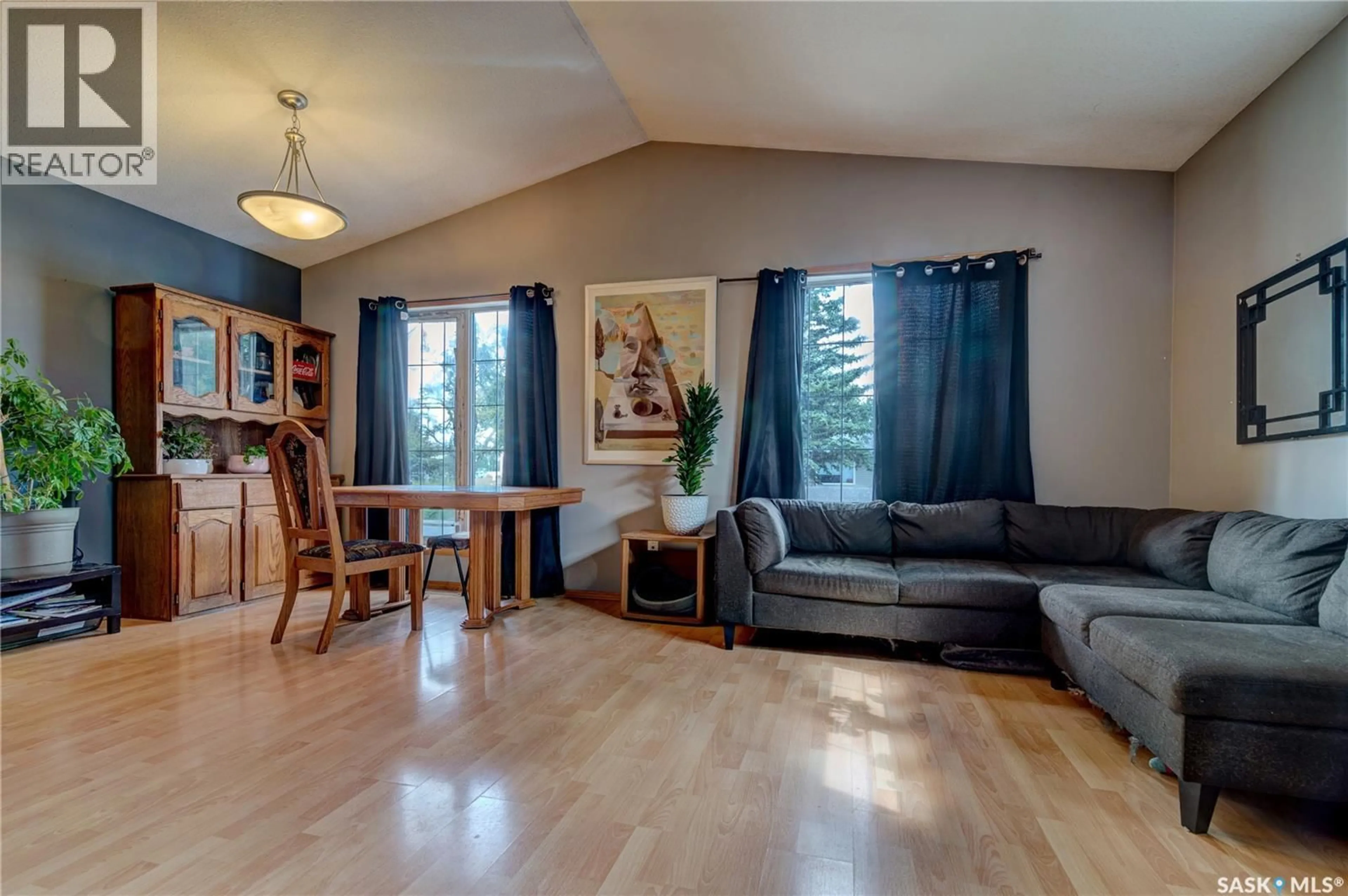 Living room with furniture, wood/laminate floor for 908 CONNAUGHT STREET, Regina Saskatchewan S4T4S6