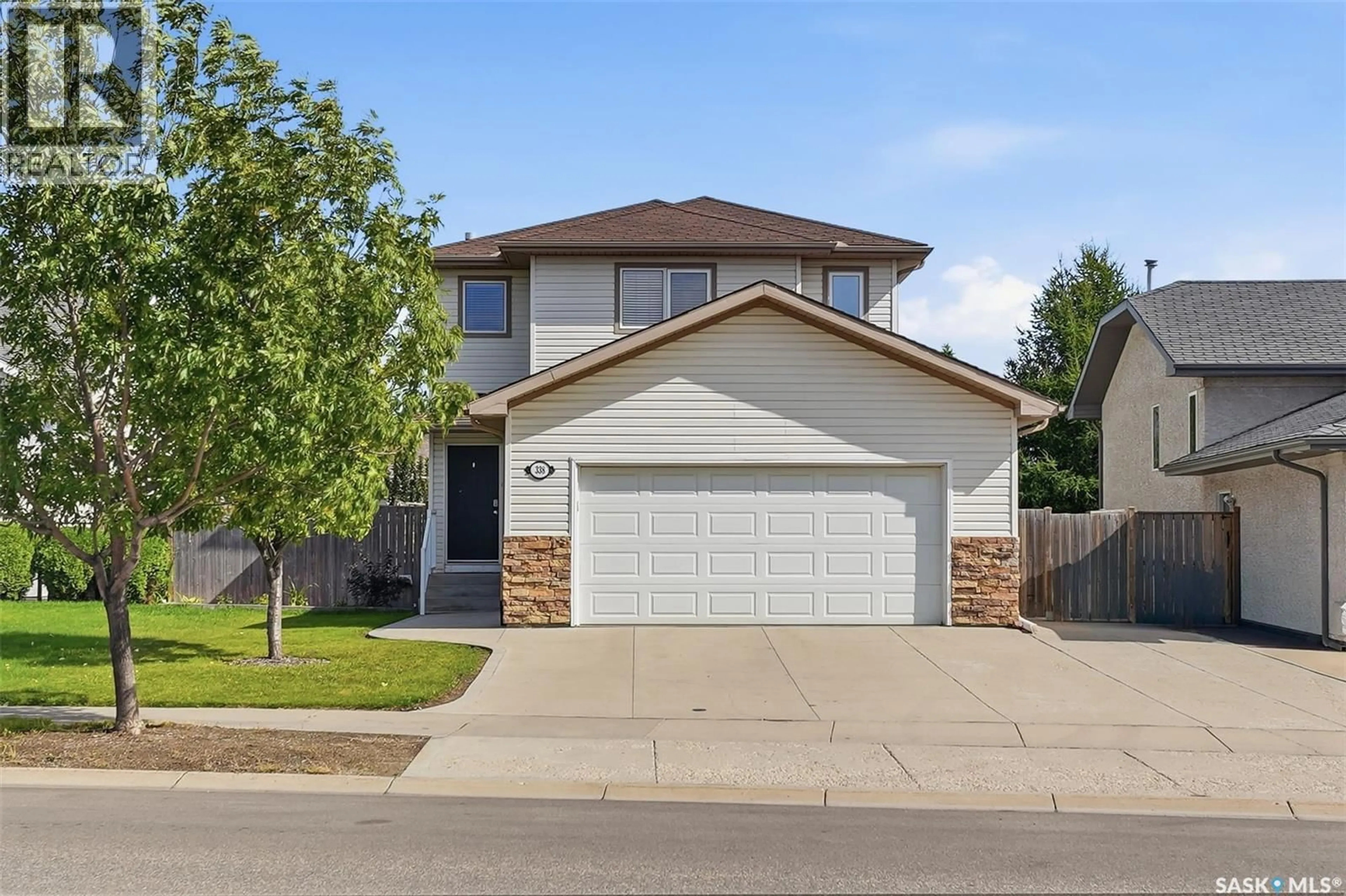Home with vinyl exterior material, street for 338 STENSRUD ROAD, Saskatoon Saskatchewan S7W1B4