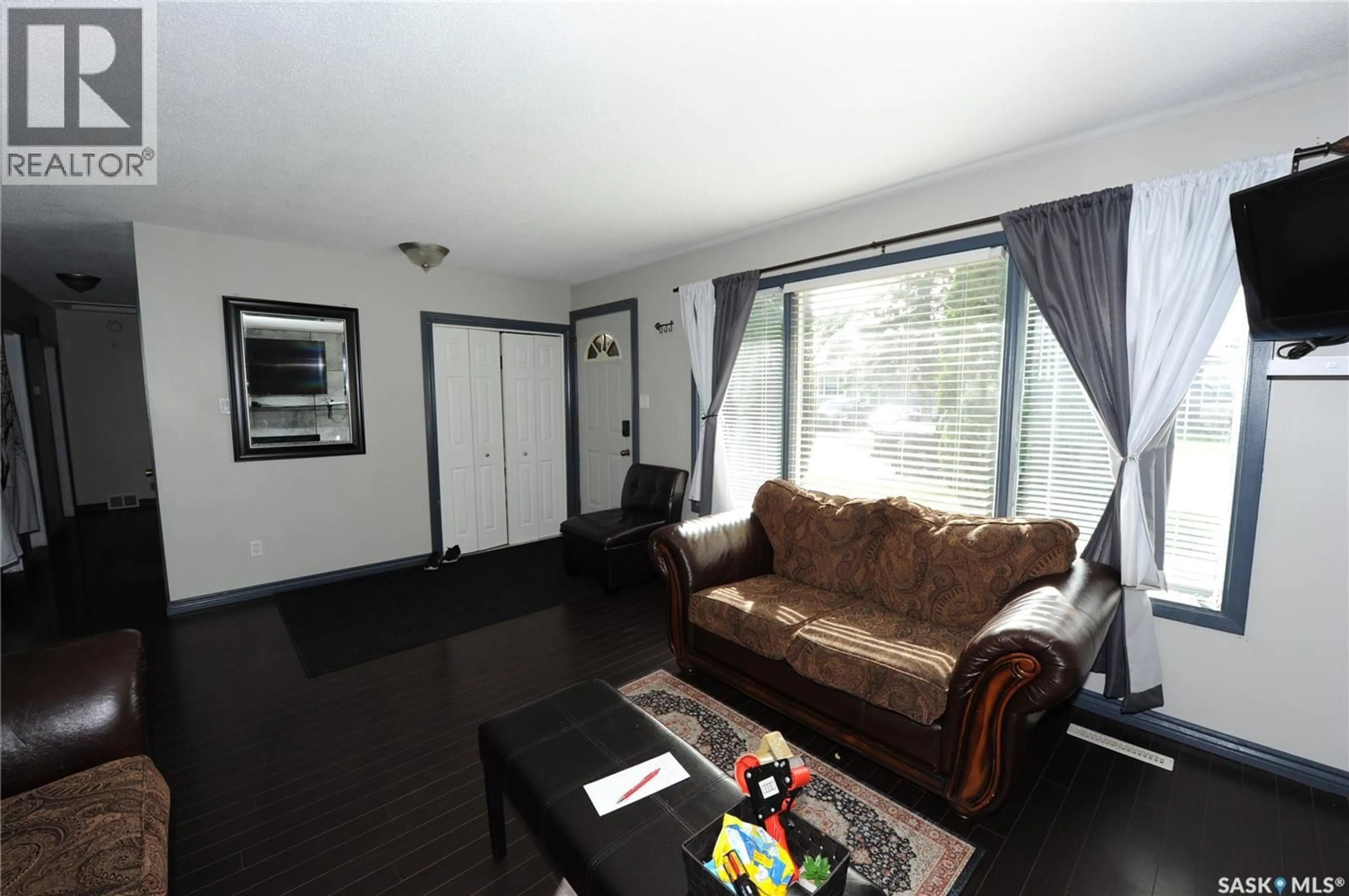 Living room with furniture, wood/laminate floor for 436 X AVENUE, Saskatoon Saskatchewan S7M3H8