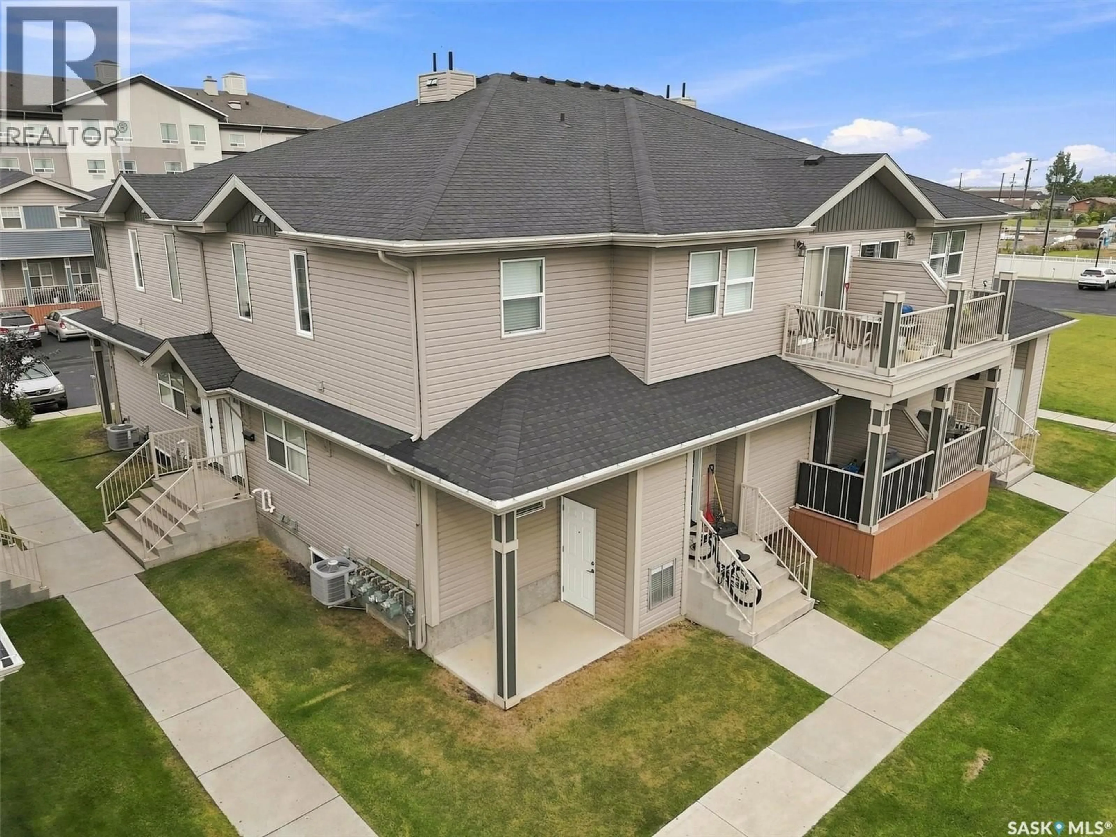 A pic from outside/outdoor area/front of a property/back of a property/a pic from drone, unknown for 100 - 222 CHAPARRAL BOULEVARD, Martensville Saskatchewan S0K0A2