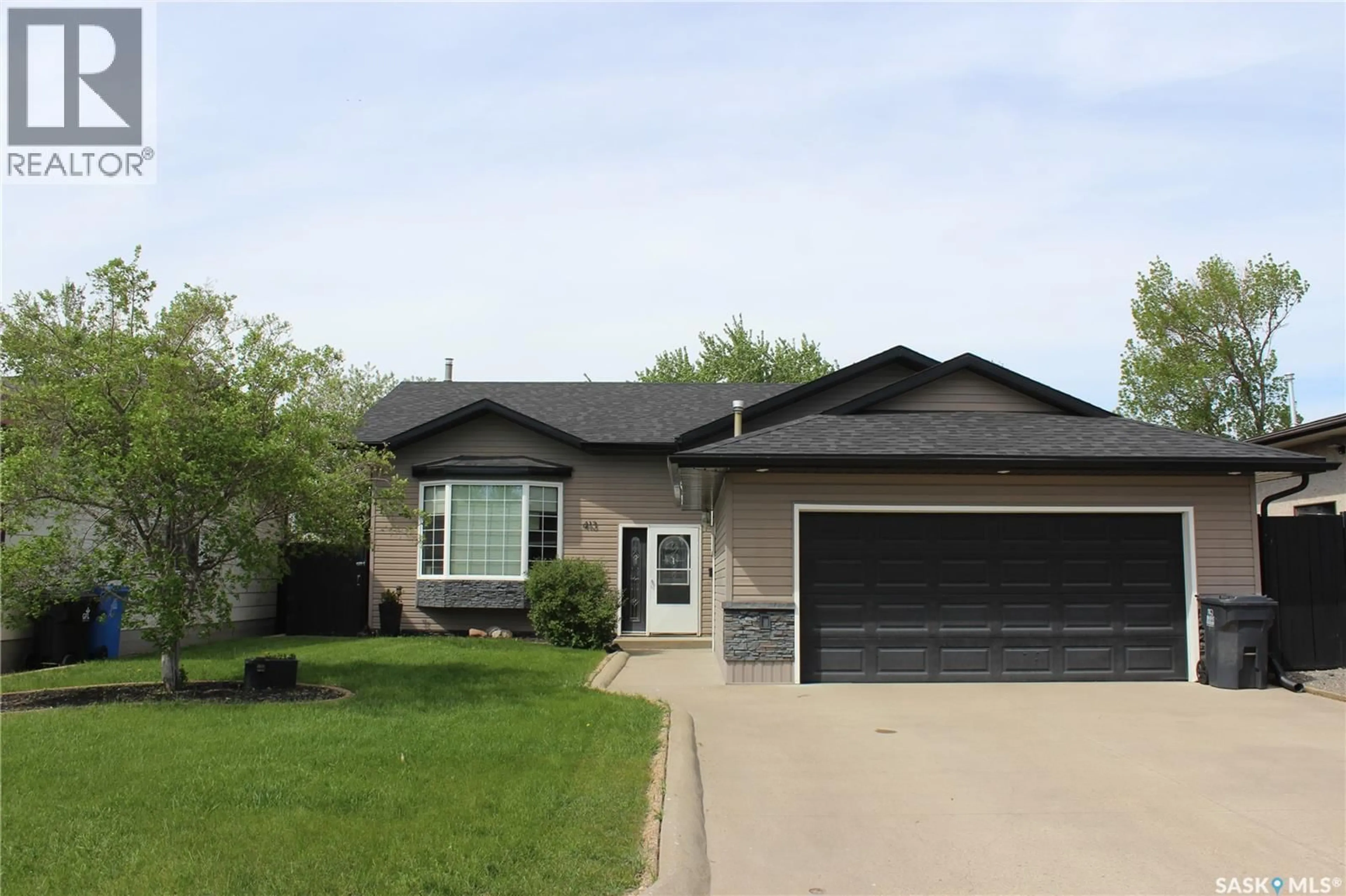 Home with vinyl exterior material, street for 413 BROOKS ROAD, Estevan Saskatchewan S4A2P2