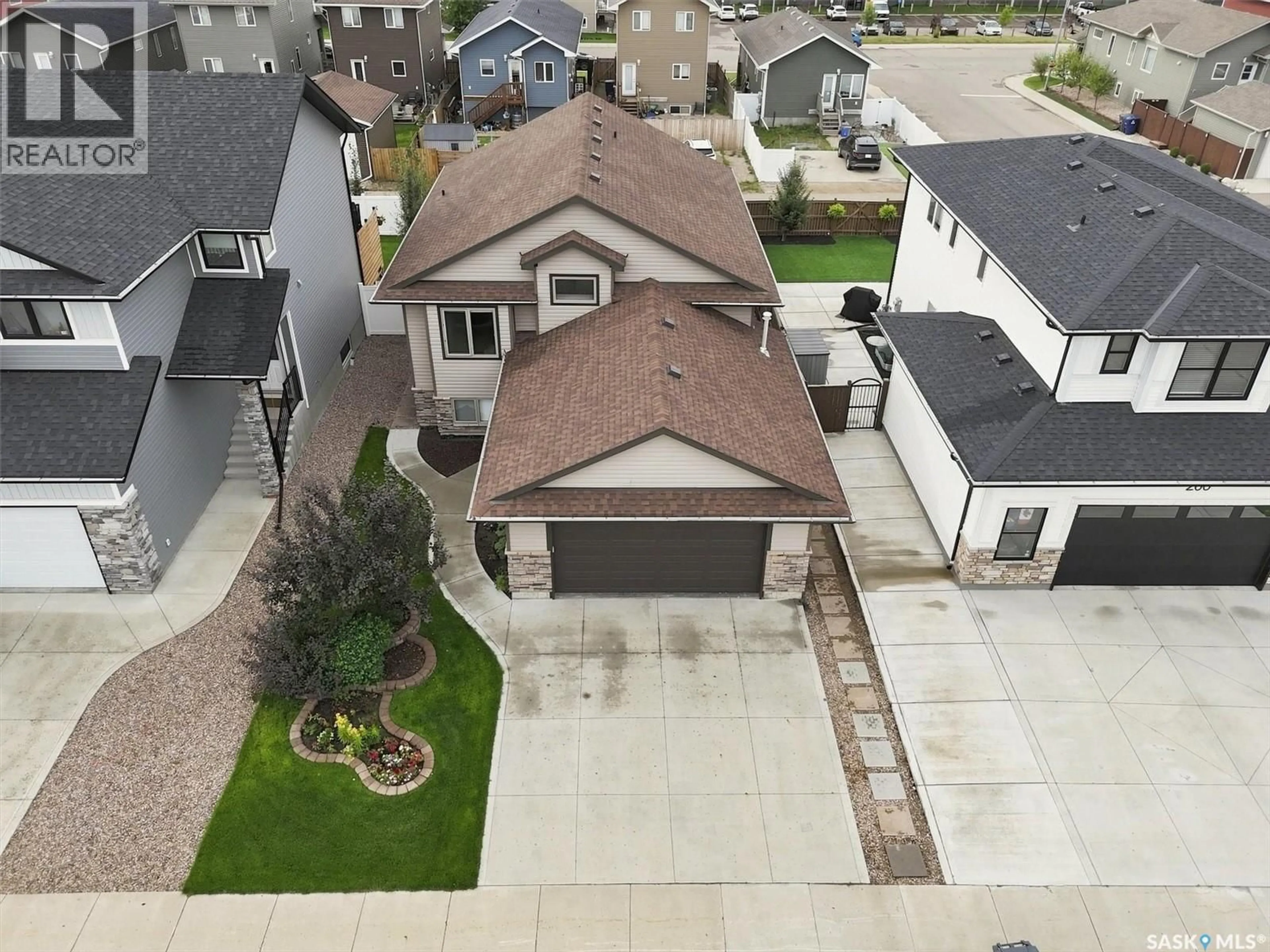 A pic from outside/outdoor area/front of a property/back of a property/a pic from drone, street for 204 COWAN CRESCENT, Martensville Saskatchewan S0K2A0