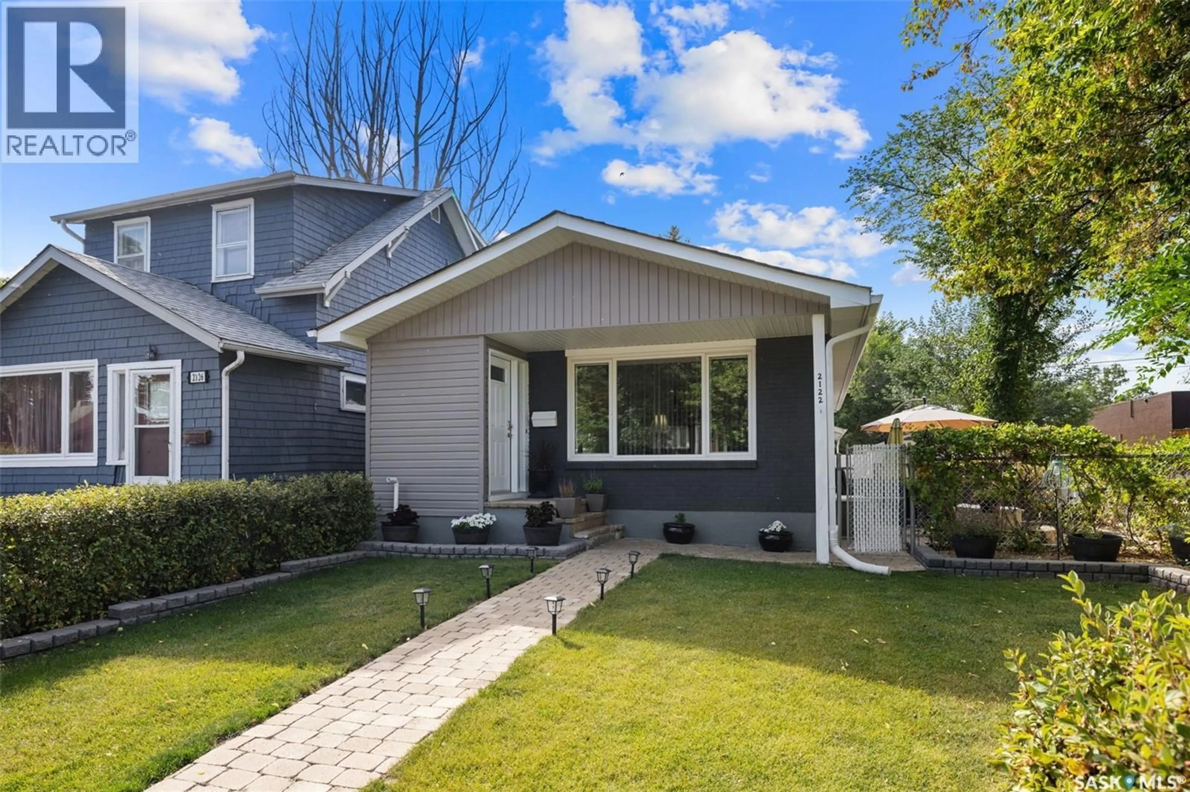 Home with vinyl exterior material, street for 2122 WASCANA STREET, Regina Saskatchewan S4T4J9