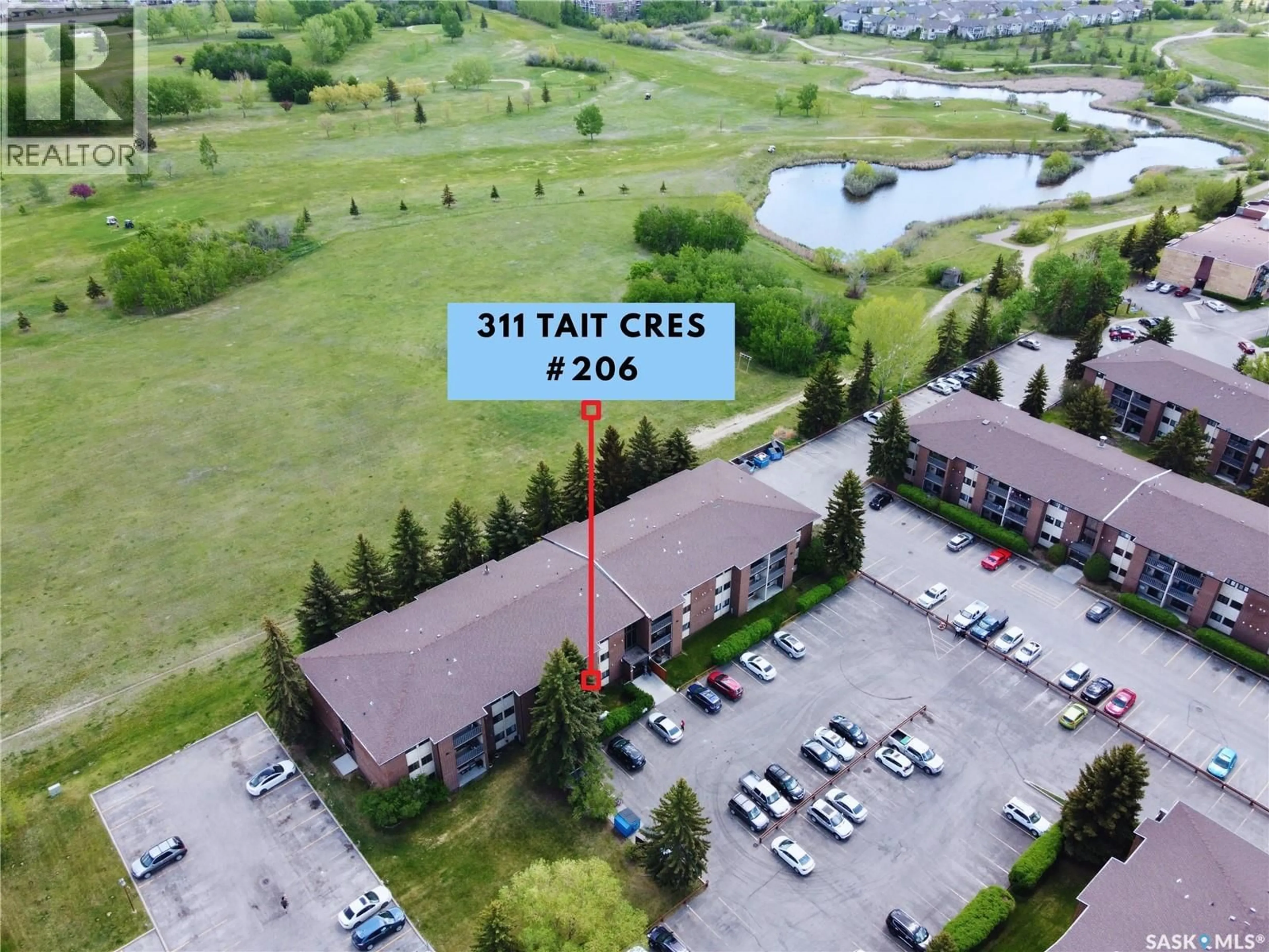 A pic from outside/outdoor area/front of a property/back of a property/a pic from drone, water/lake/river/ocean view for 206 311 TAIT CRESCENT, Saskatoon Saskatchewan S7H5L6