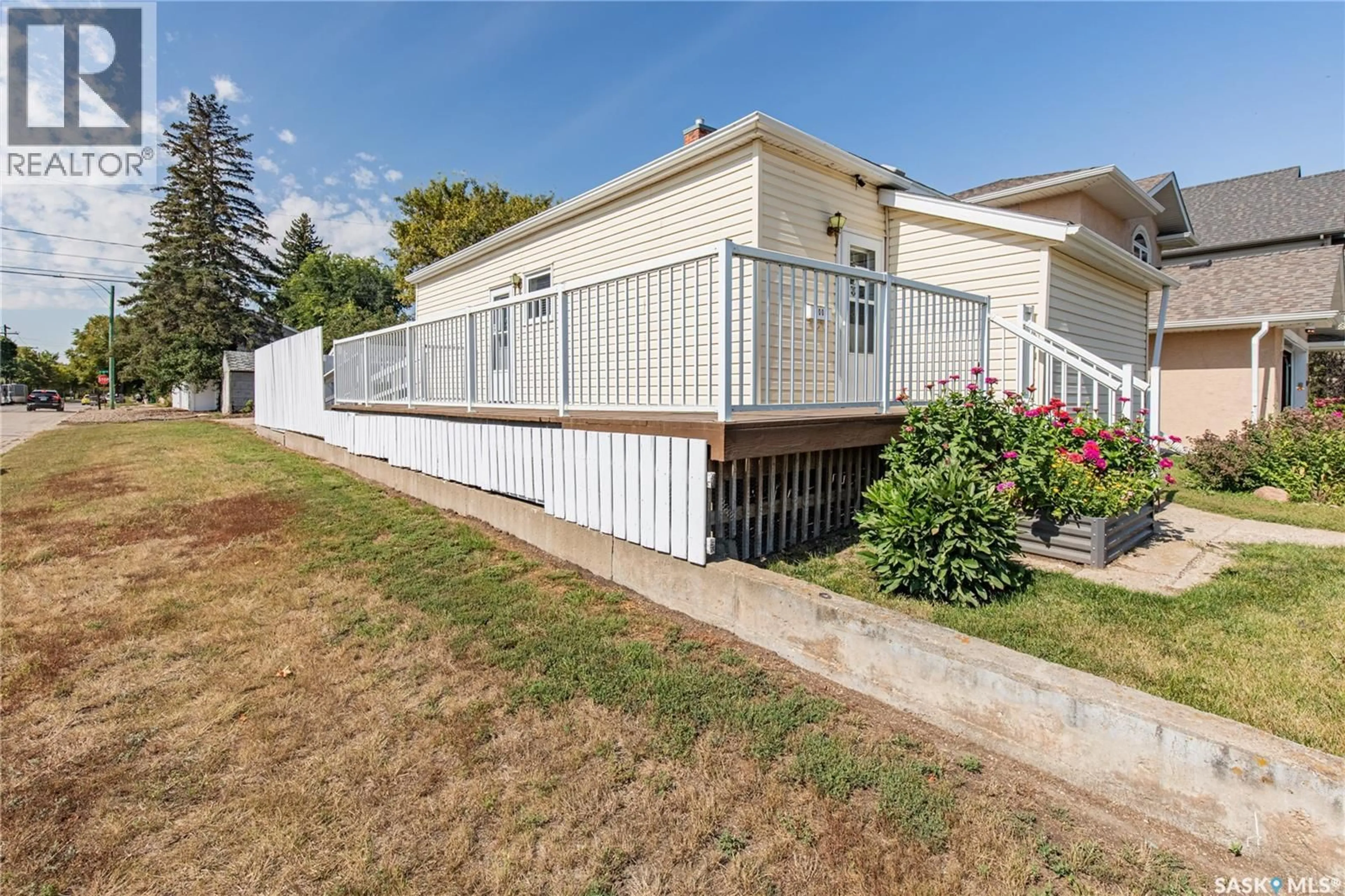 Home with vinyl exterior material, street for 1002 WOLFE AVENUE, Moose Jaw Saskatchewan S6H1J7