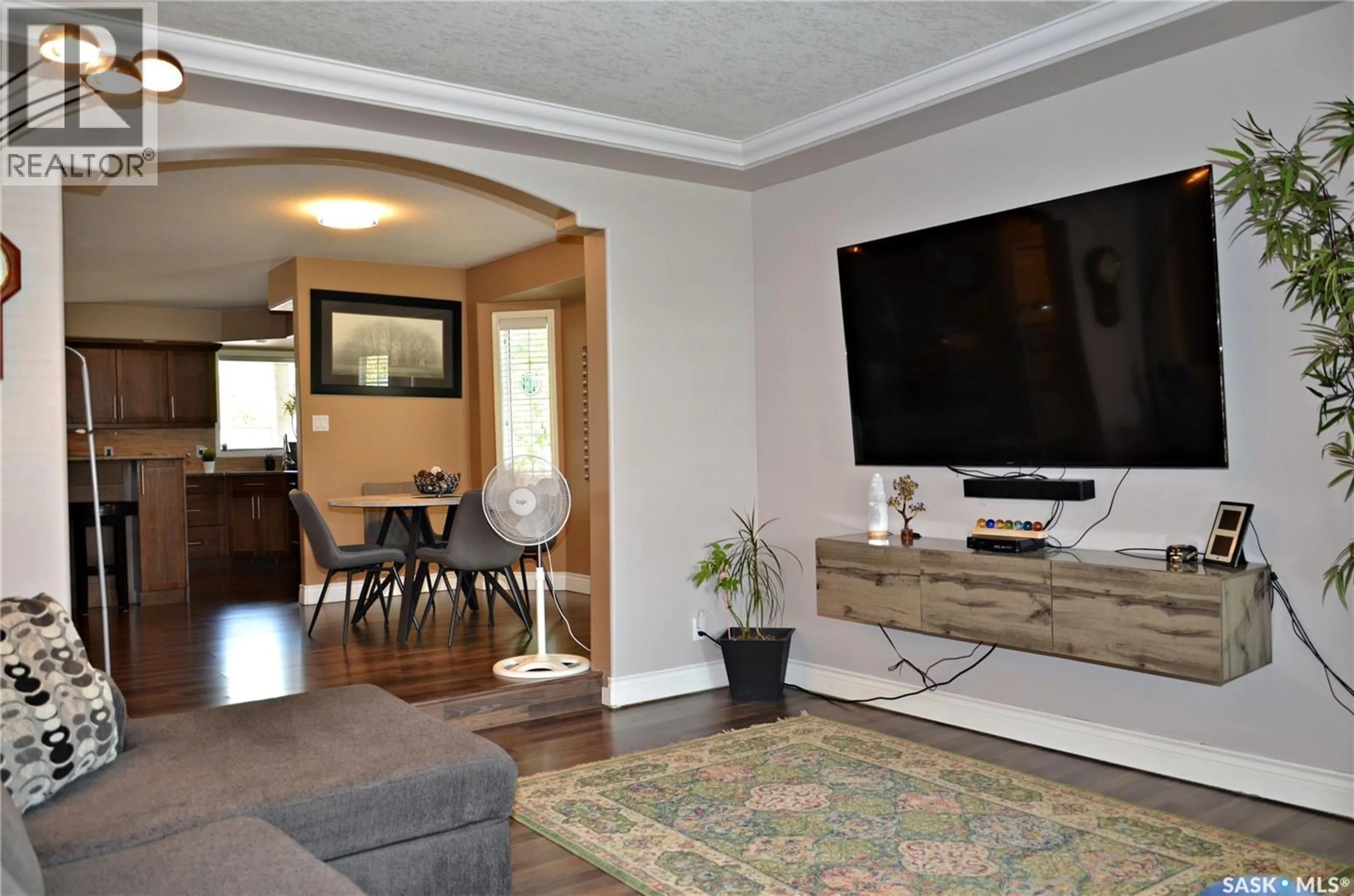 Living room with furniture, wood/laminate floor for 417 4TH AVENUE, Martensville Saskatchewan S0K2T2
