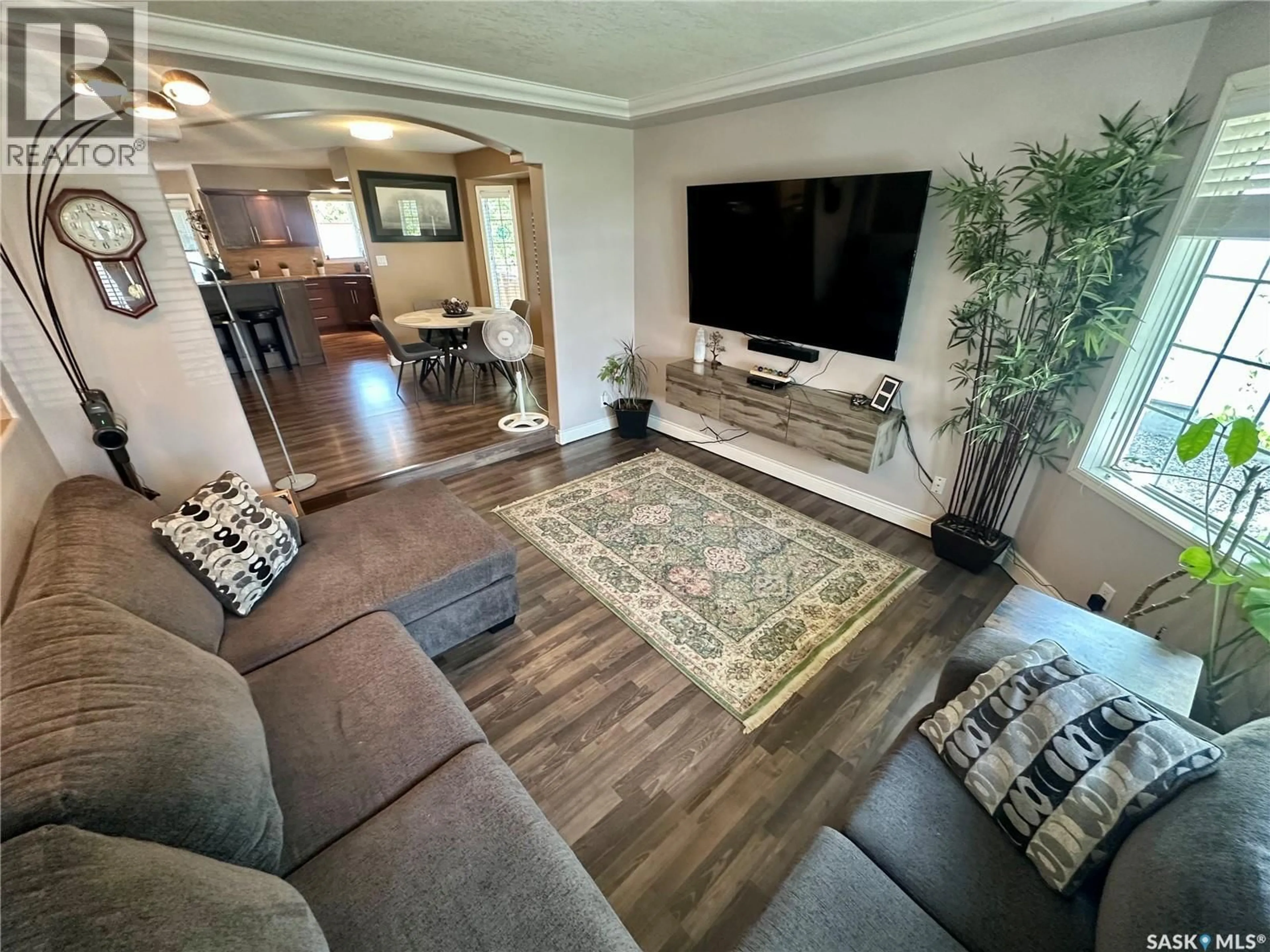 Living room with furniture, wood/laminate floor for 417 4TH AVENUE, Martensville Saskatchewan S0K2T2