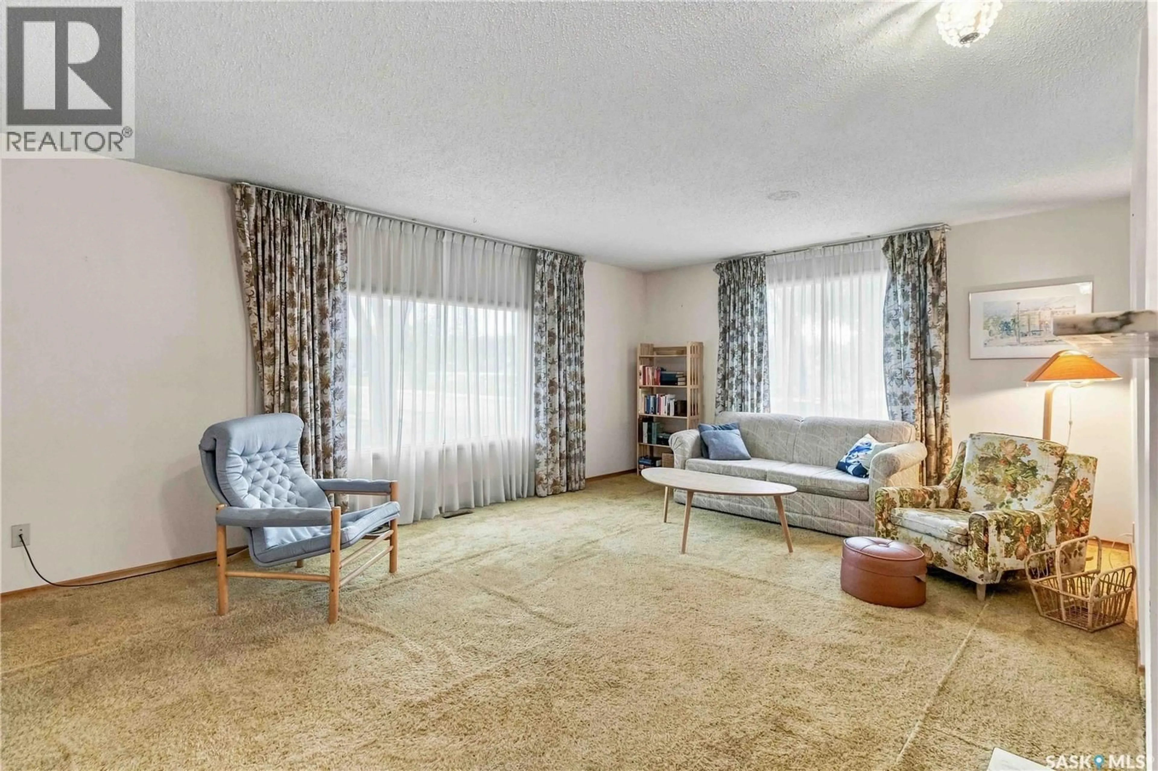 Living room with furniture, carpet floor for 201 ELM STREET, Saskatoon Saskatchewan S7J0G8