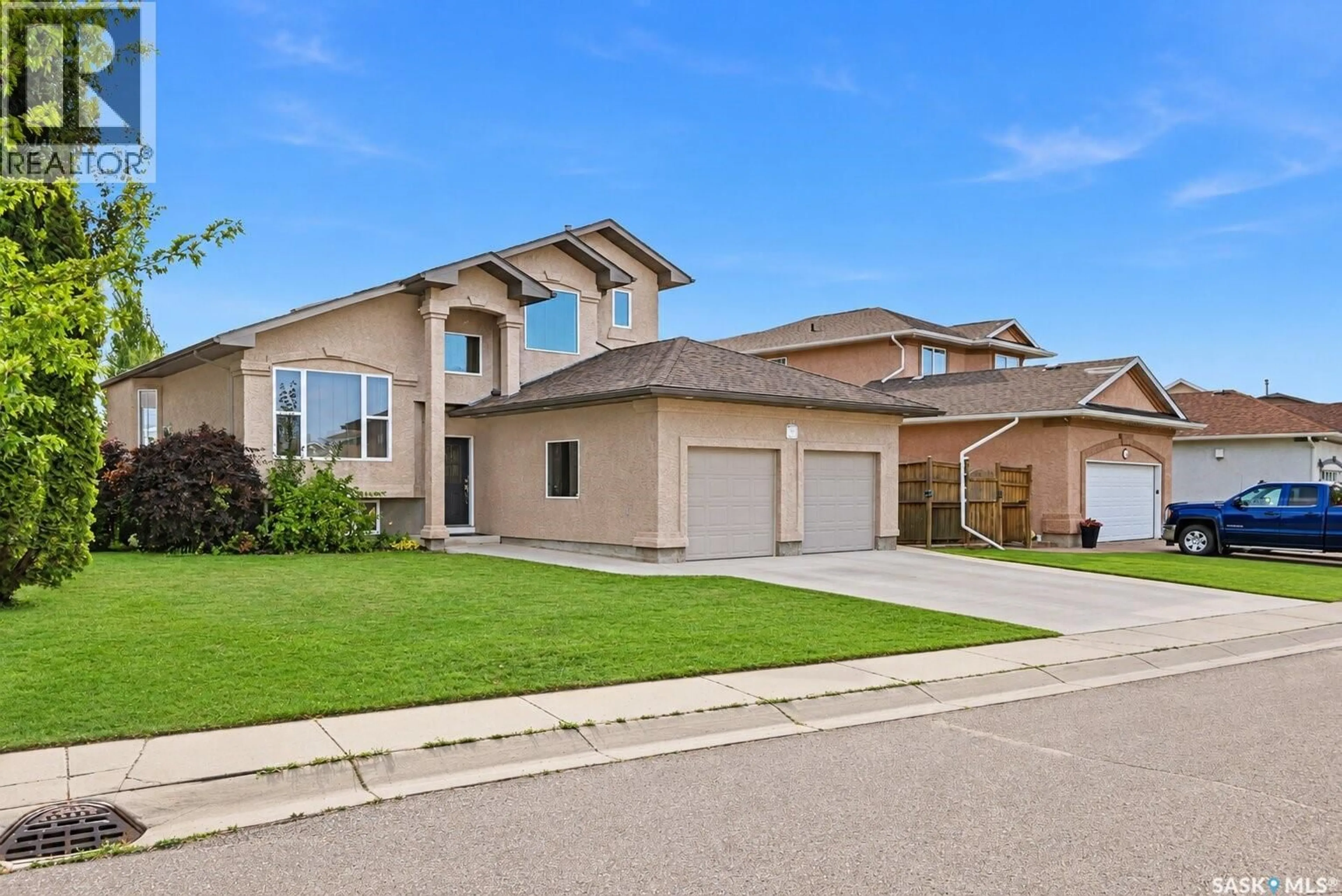 Home with vinyl exterior material, street for 703 BEECHMONT LANE, Saskatoon Saskatchewan S7V1C9