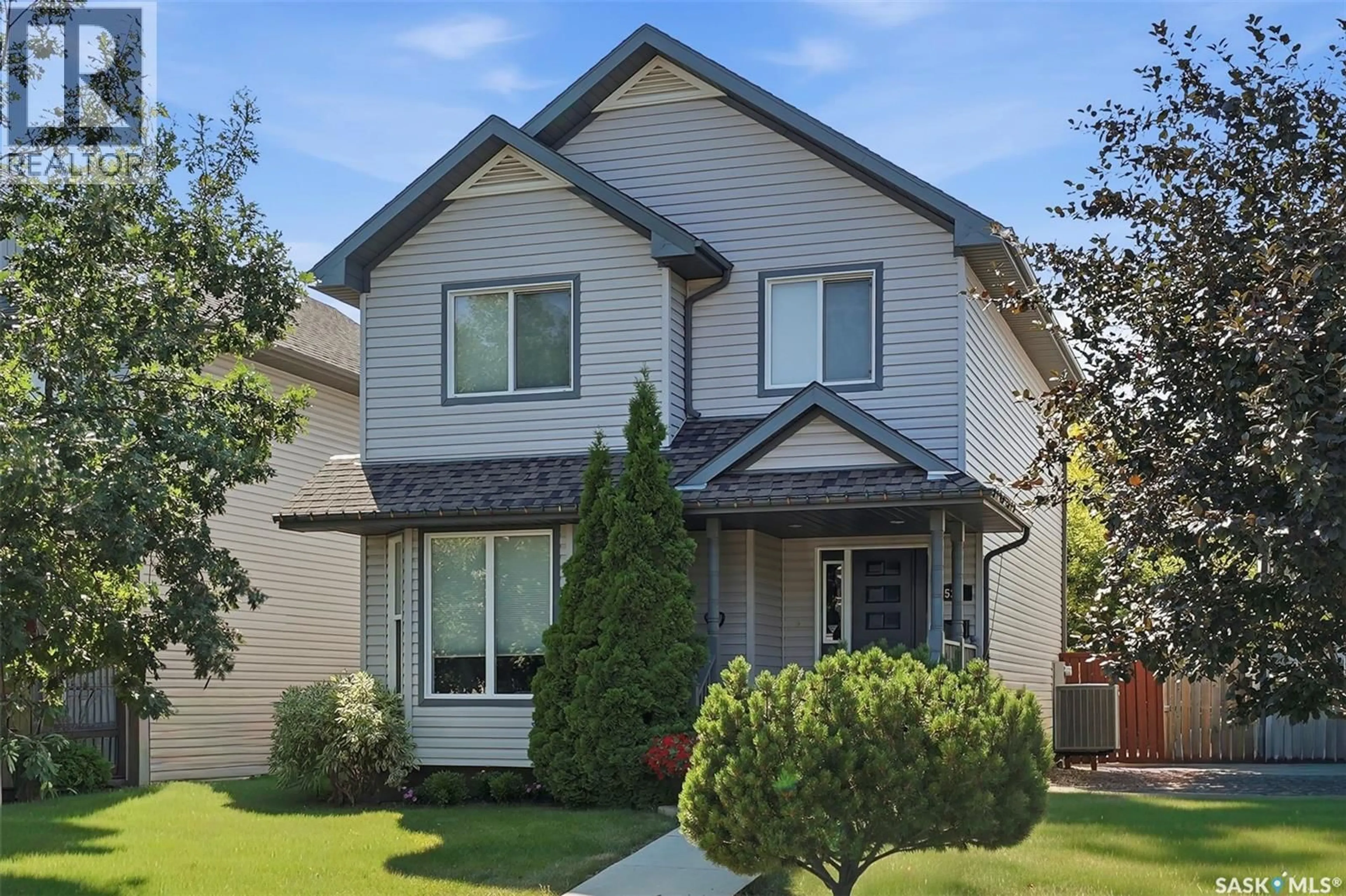 Home with vinyl exterior material, street for 523 DENHAM WAY, Saskatoon Saskatchewan S7R1E5