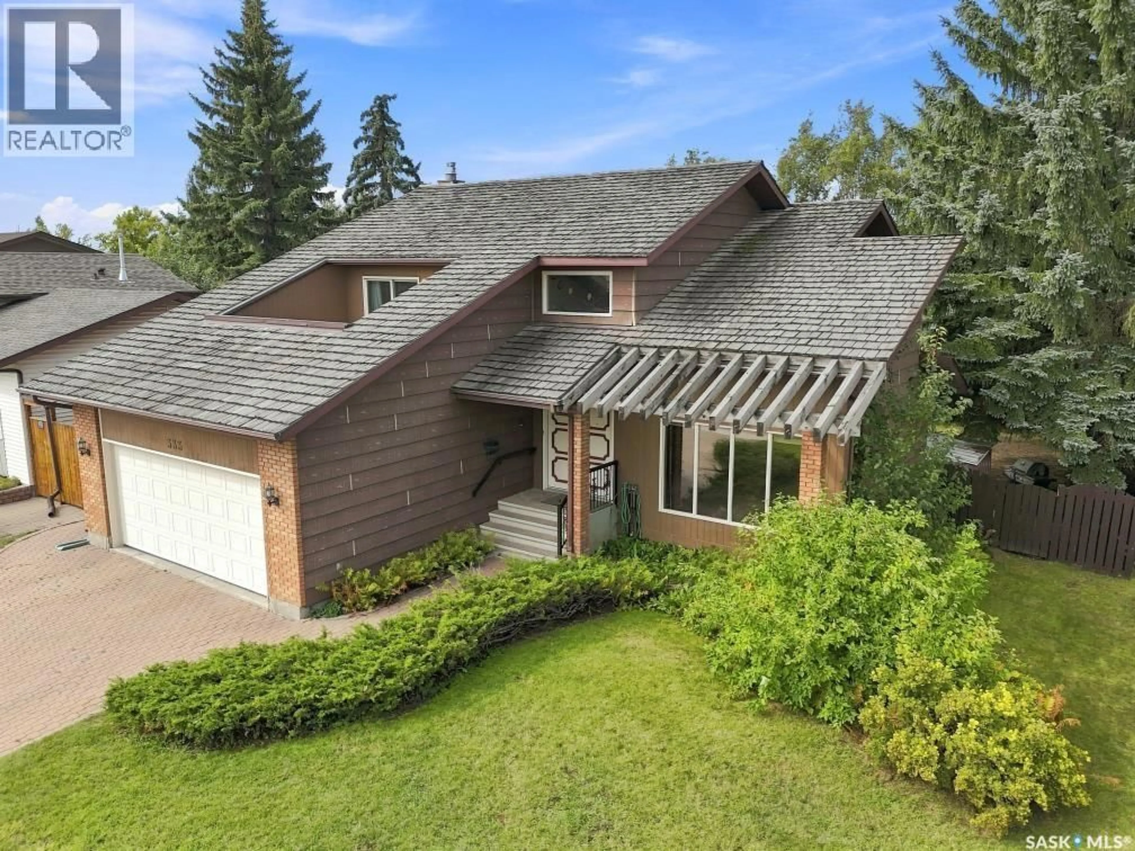 A pic from outside/outdoor area/front of a property/back of a property/a pic from drone, street for 333 REID ROAD, Saskatoon Saskatchewan S7N3J8