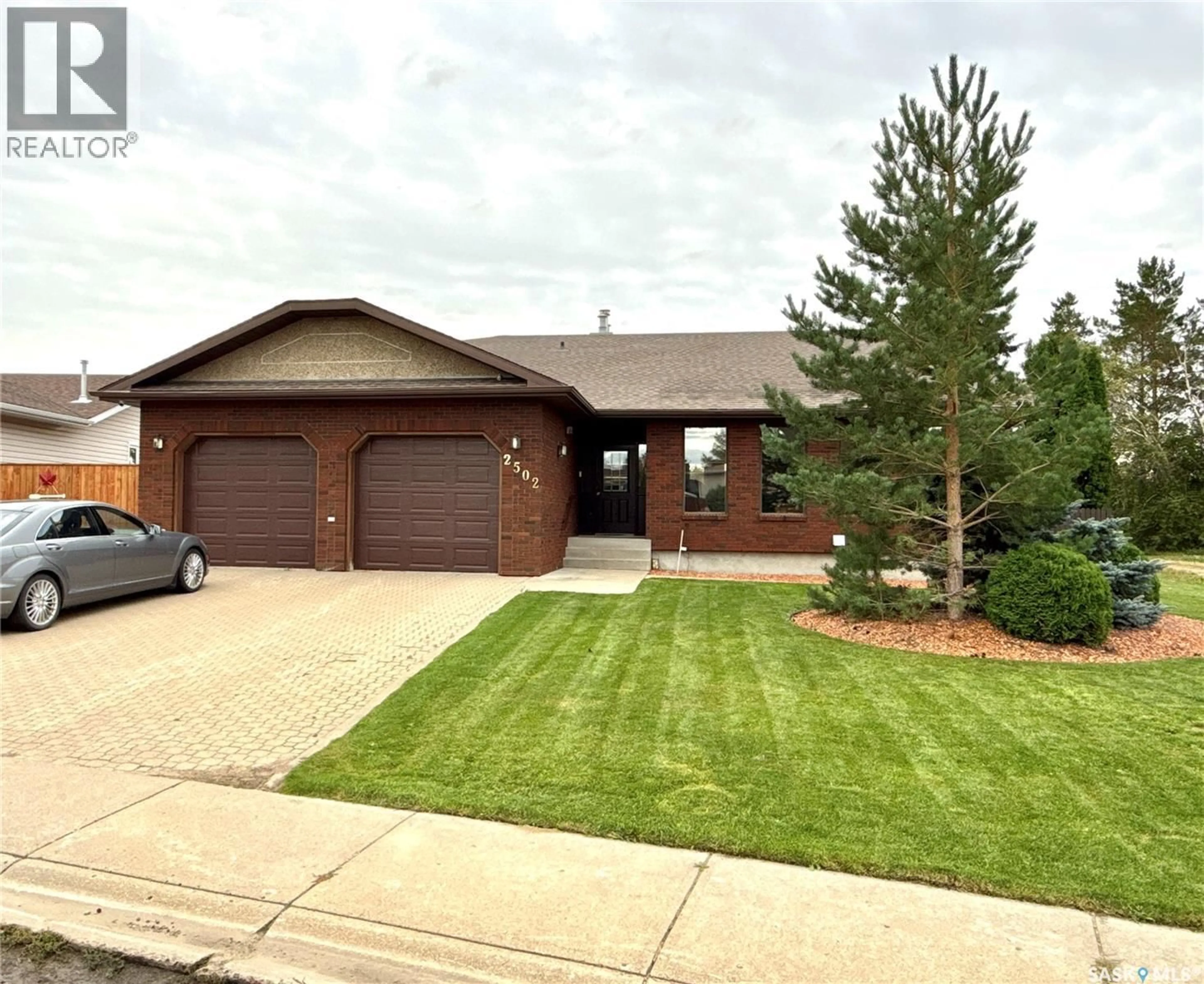 Home with brick exterior material, street for 2502 BLUE JAY CRESCENT, North Battleford Saskatchewan S9A3Z3