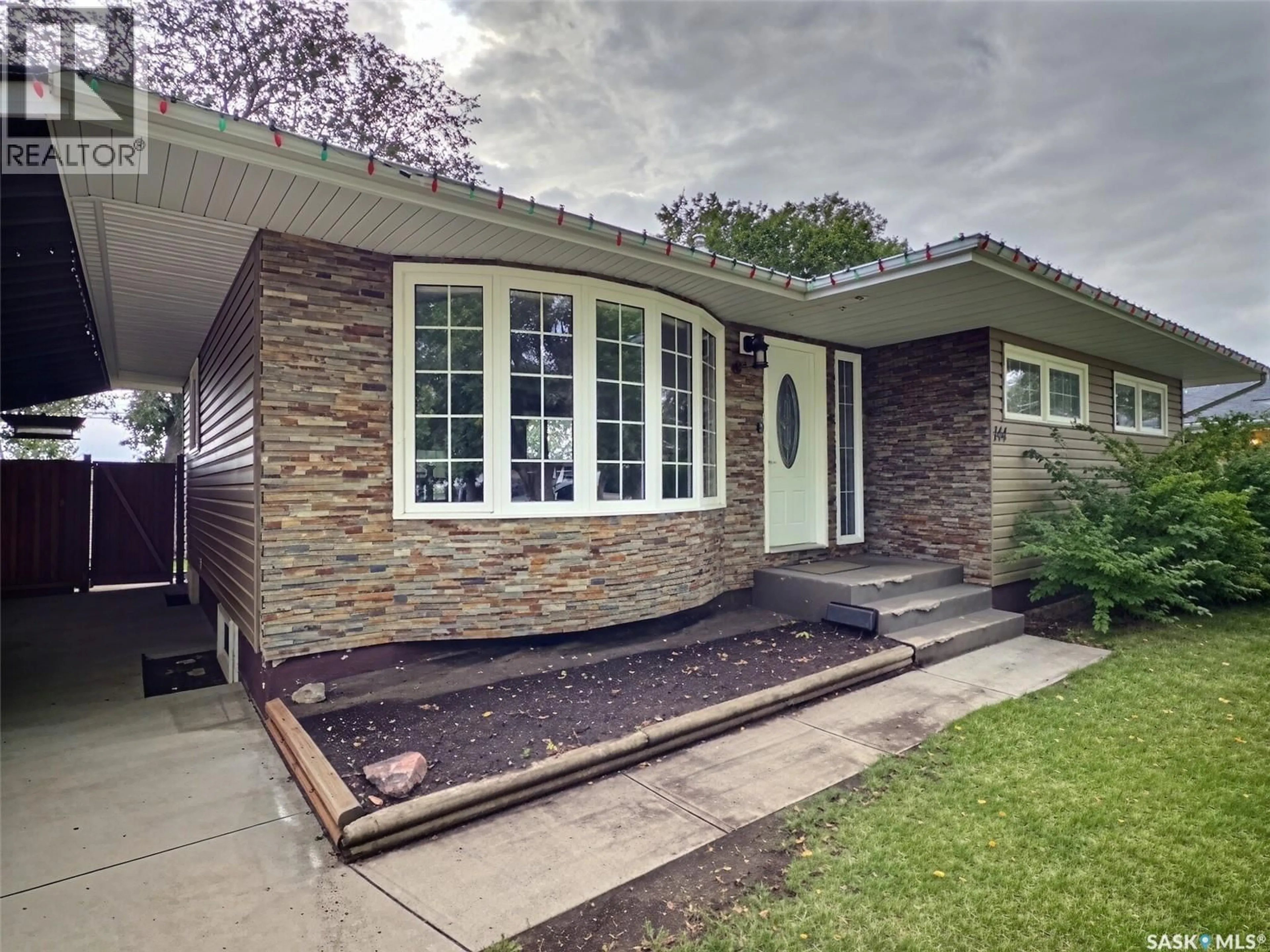 Home with brick exterior material, street for 144 MCDONALD ROAD, Estevan Saskatchewan S4A0B8