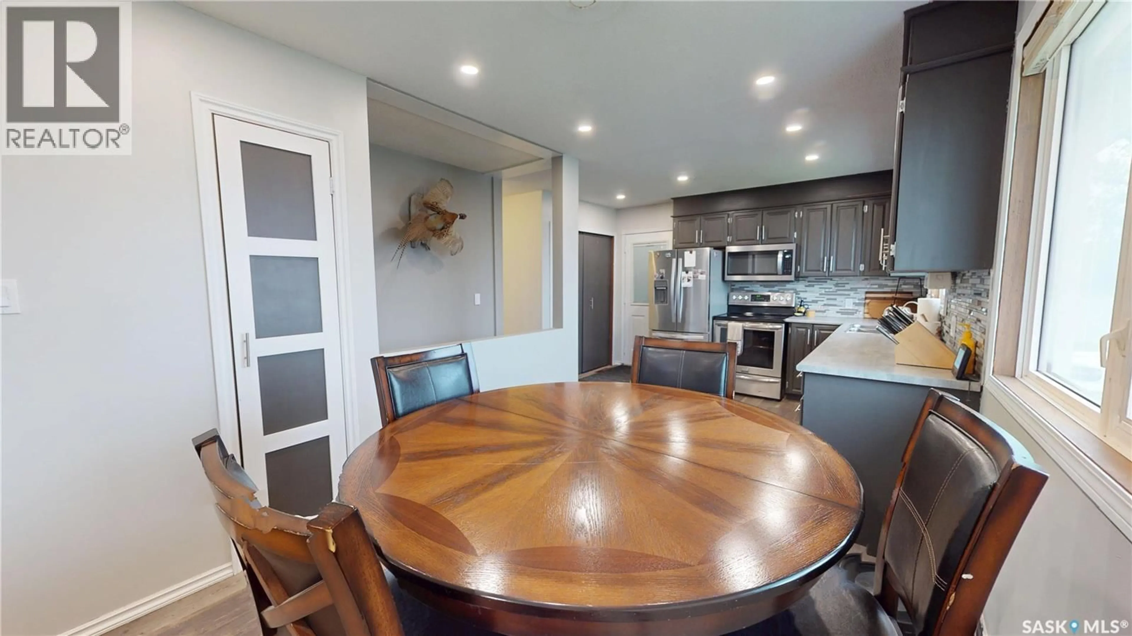 Open concept kitchen, wood/laminate floor for 110 WRIGHT ROAD, Moosomin Saskatchewan S0G3N0