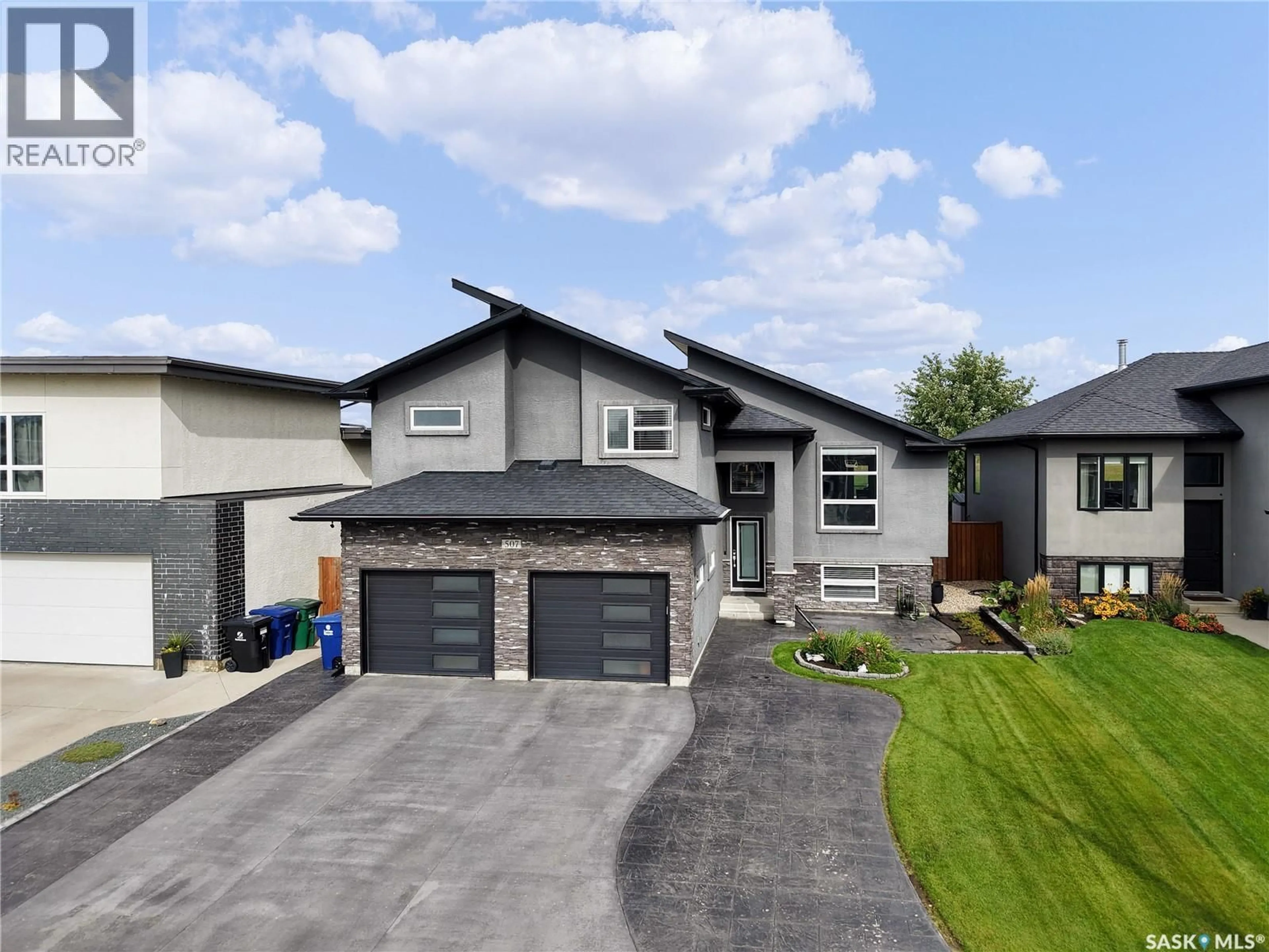 Home with brick exterior material, street for 507 SALLOUM CRESCENT, Saskatoon Saskatchewan S7W0N1