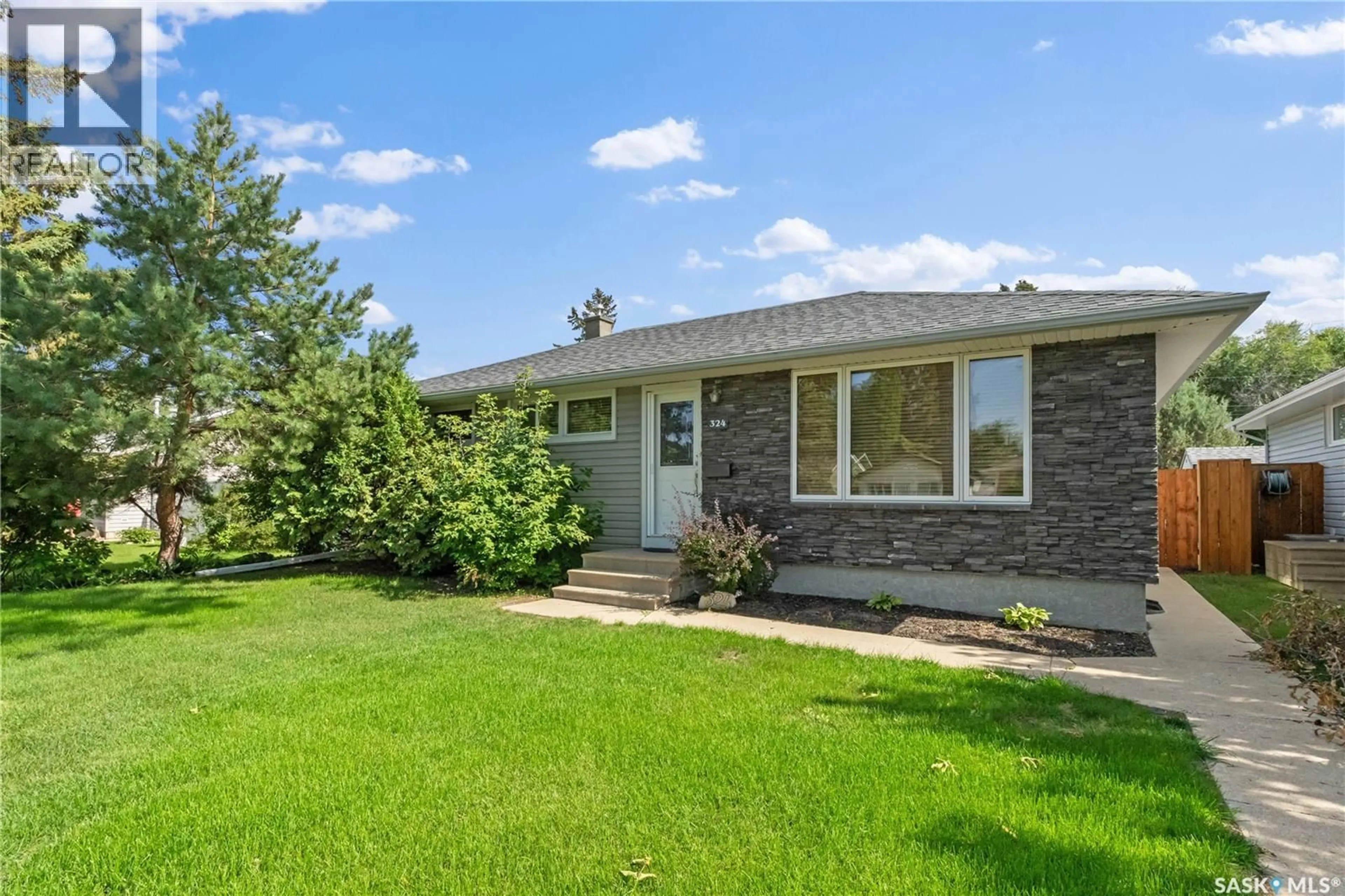 Home with vinyl exterior material, street for 324 Y AVENUE, Saskatoon Saskatchewan S7L3K9