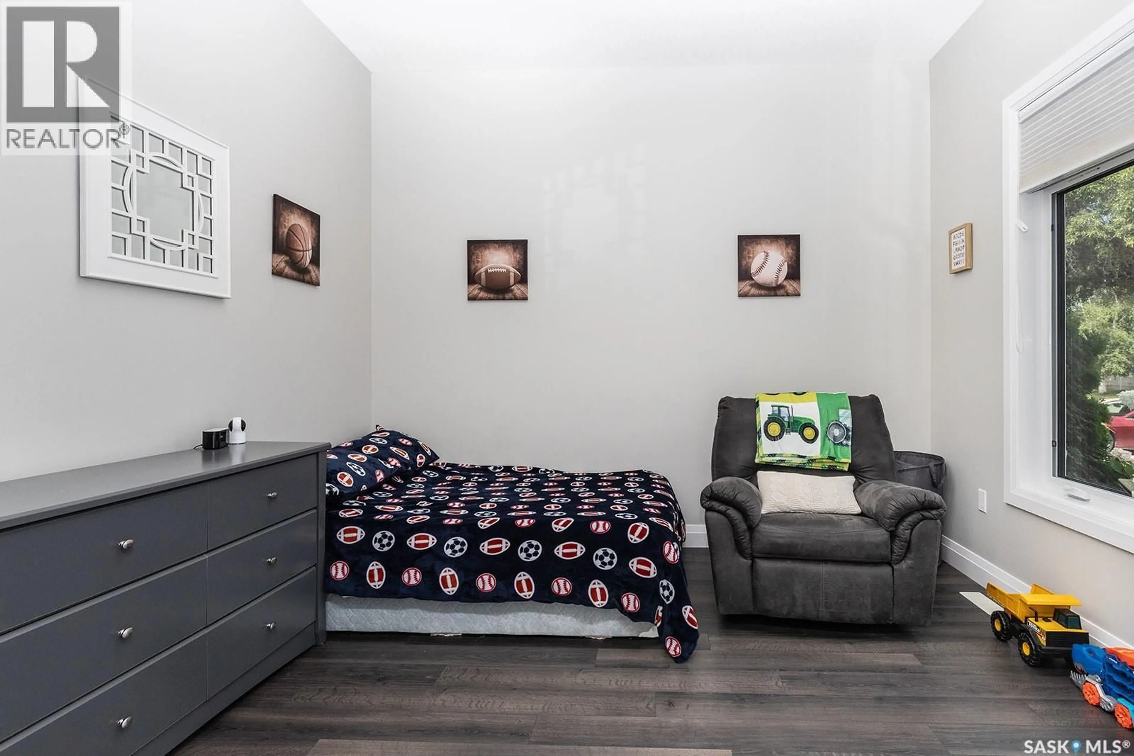 Bedroom with bed, wood/laminate floor for 355 COPPERMINE CRESCENT, Saskatoon Saskatchewan S7K4L5