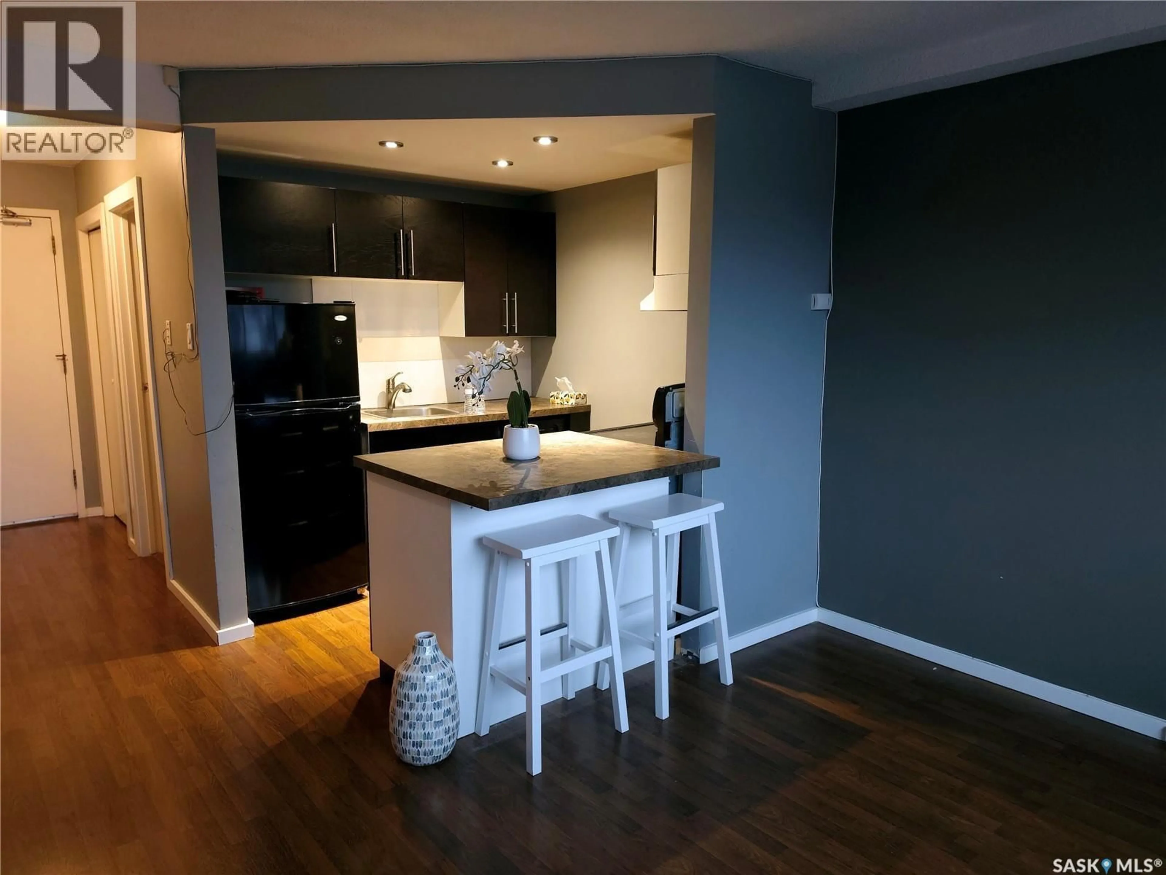 Open concept kitchen, wood/laminate floor for 5 SUMMERS PLACE, Saskatoon Saskatchewan S7H3W4